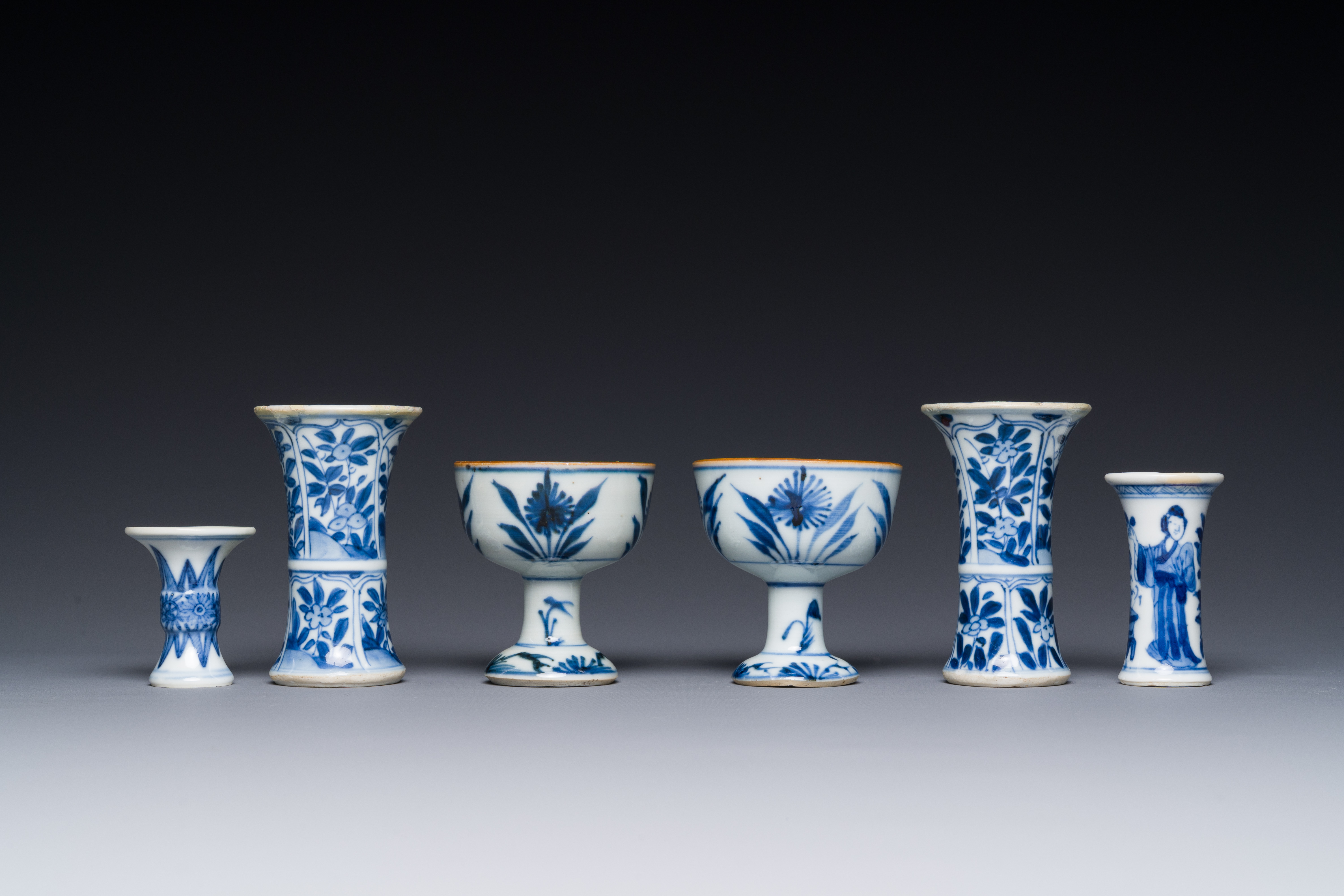 Two Chinese blue and white stem cups and four miniature 'gu' vases, Kangxi - Image 4 of 6