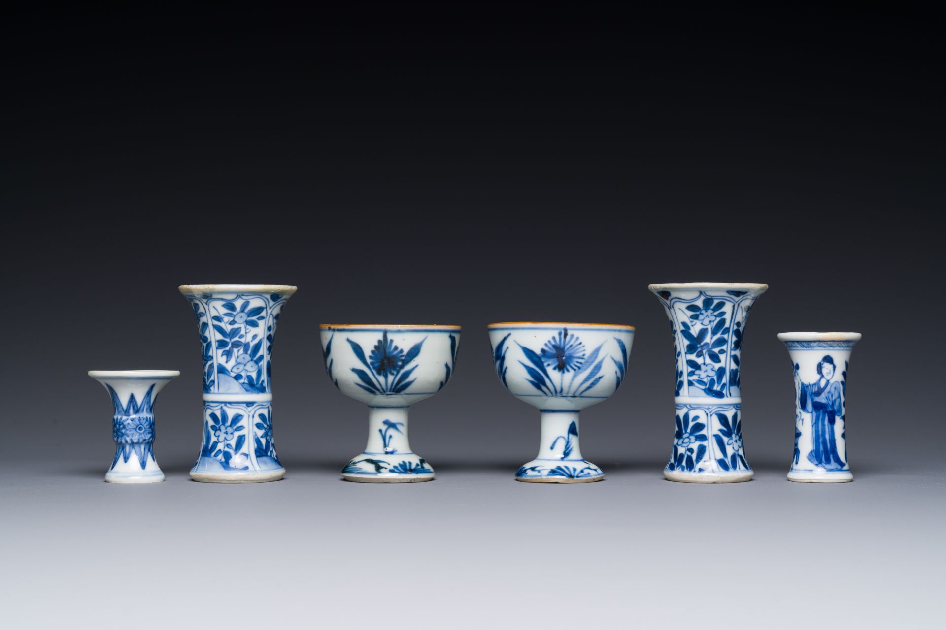 Two Chinese blue and white stem cups and four miniature 'gu' vases, Kangxi - Image 4 of 6