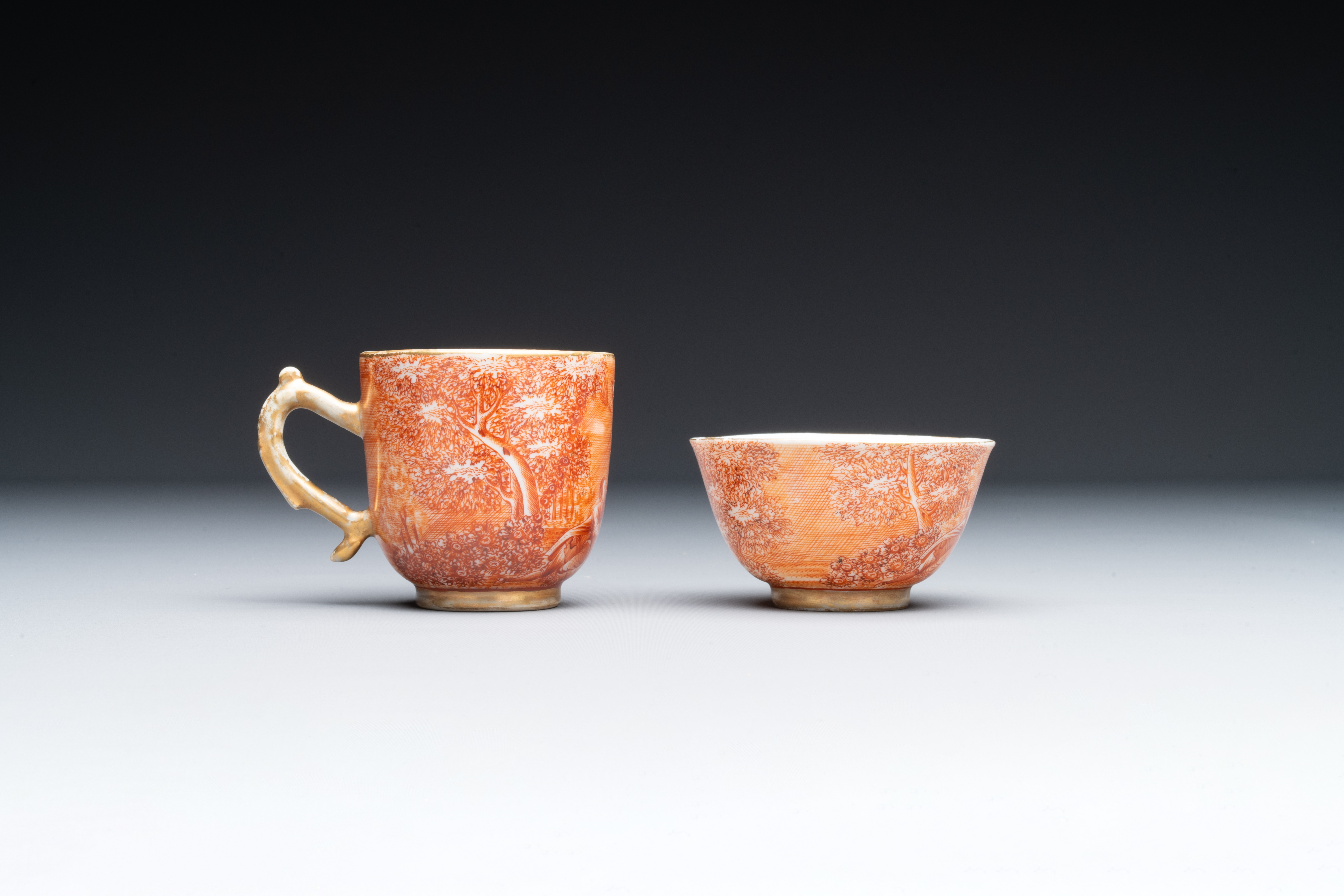 Two rare Chinese iron-red-decorated 'European scene' cups and a saucer, Qianlong - Image 4 of 8