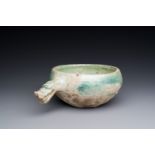 A Chinese monochrome green-glazed pottery scoop, Han