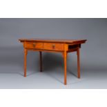 A Chinese huanghuali wooden two-drawer recessed-leg table, 19/20th C.