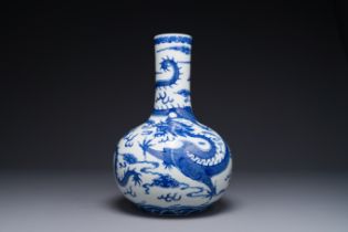 A Chinese blue and white 'dragon' bottle vase, Yongzheng mark, 19th C.