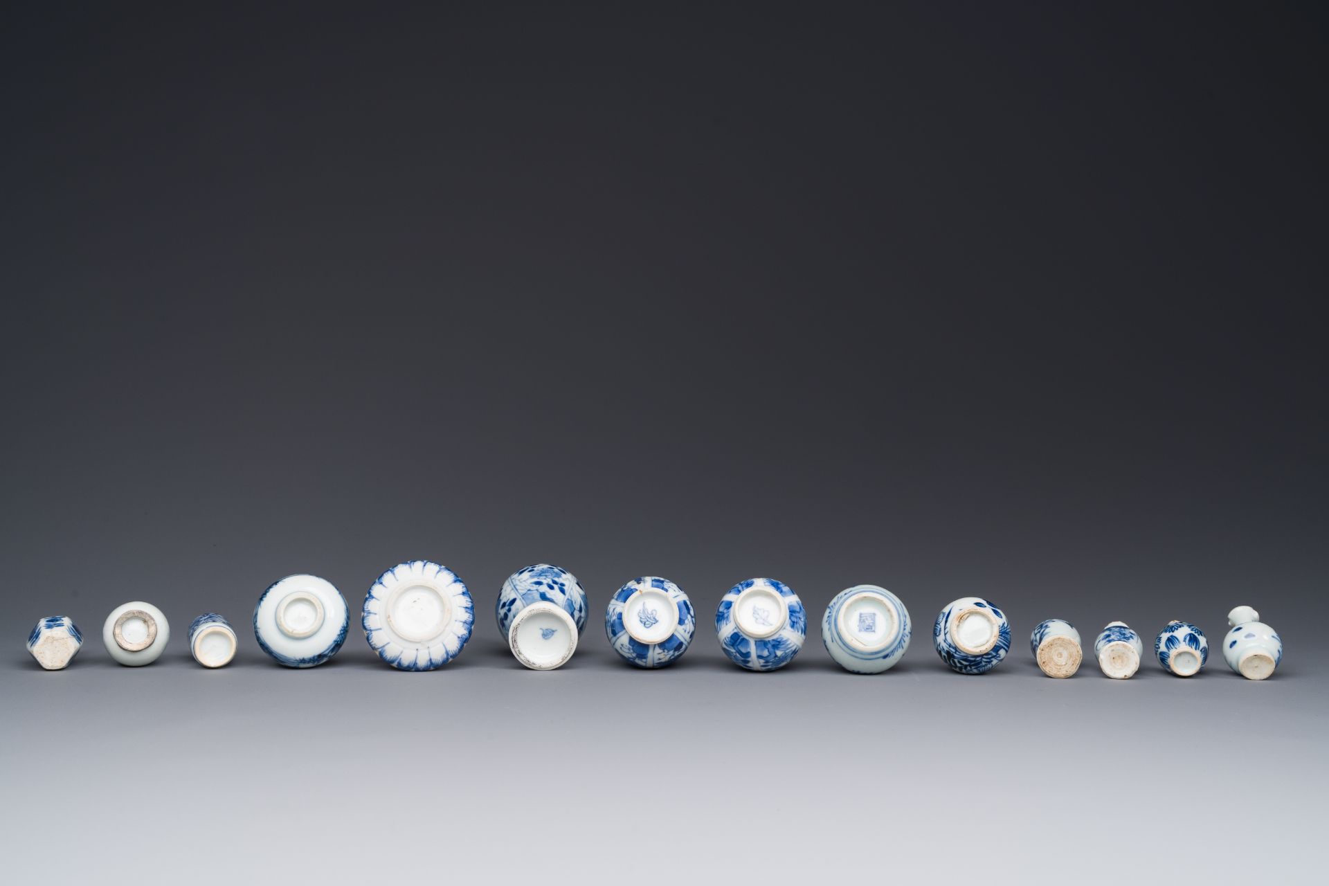 Fourteen Chinese blue and white miniature vases with floral design, Kangxi - Image 4 of 4