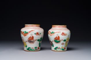 A pair of small Chinese wucai jars with figures in a landscape, Transition period