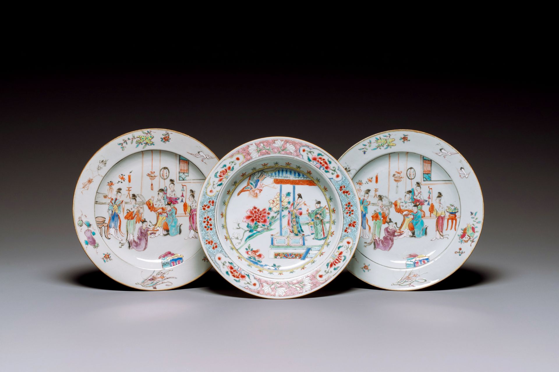 A pair of Chinese famille rose plates with mandarin design and a famille rose 'Xi Xiang Ji' plate, Y