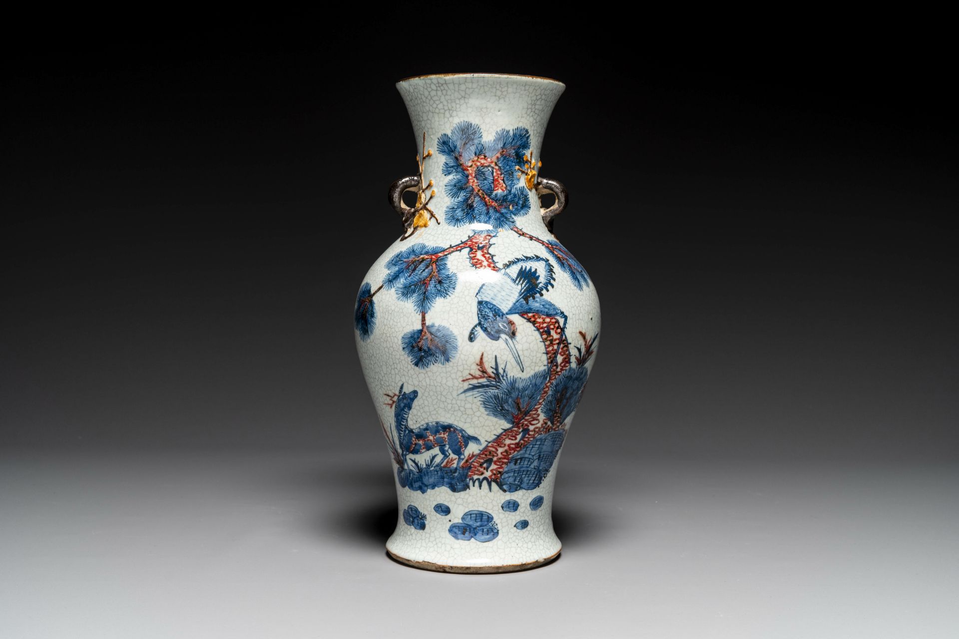 A Chinese blue, white and copper-red Nanking crackle-glazed vase, 19th C.