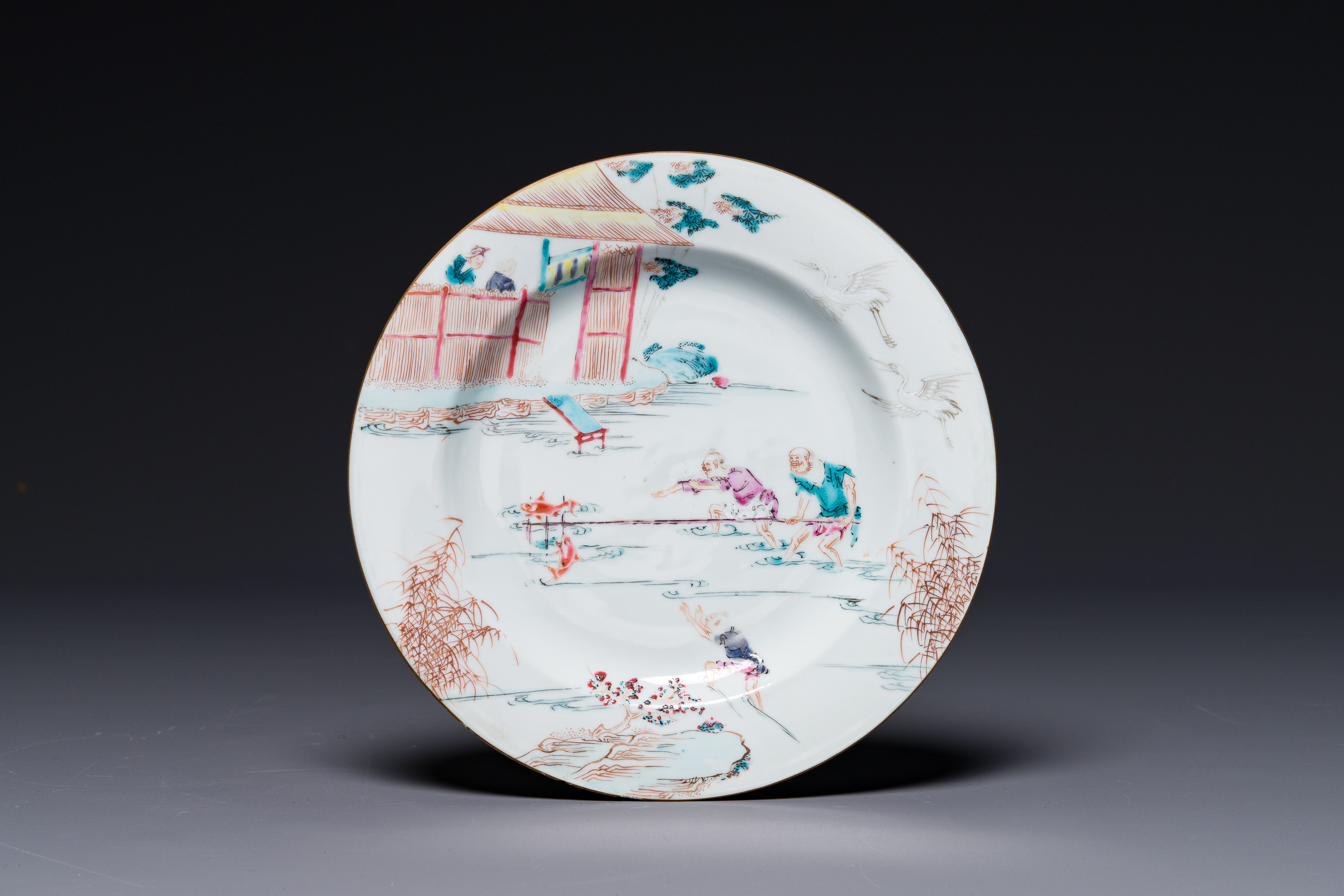 A Chinese famille rose 'fishermen' plate, Yongzheng/Qianlong