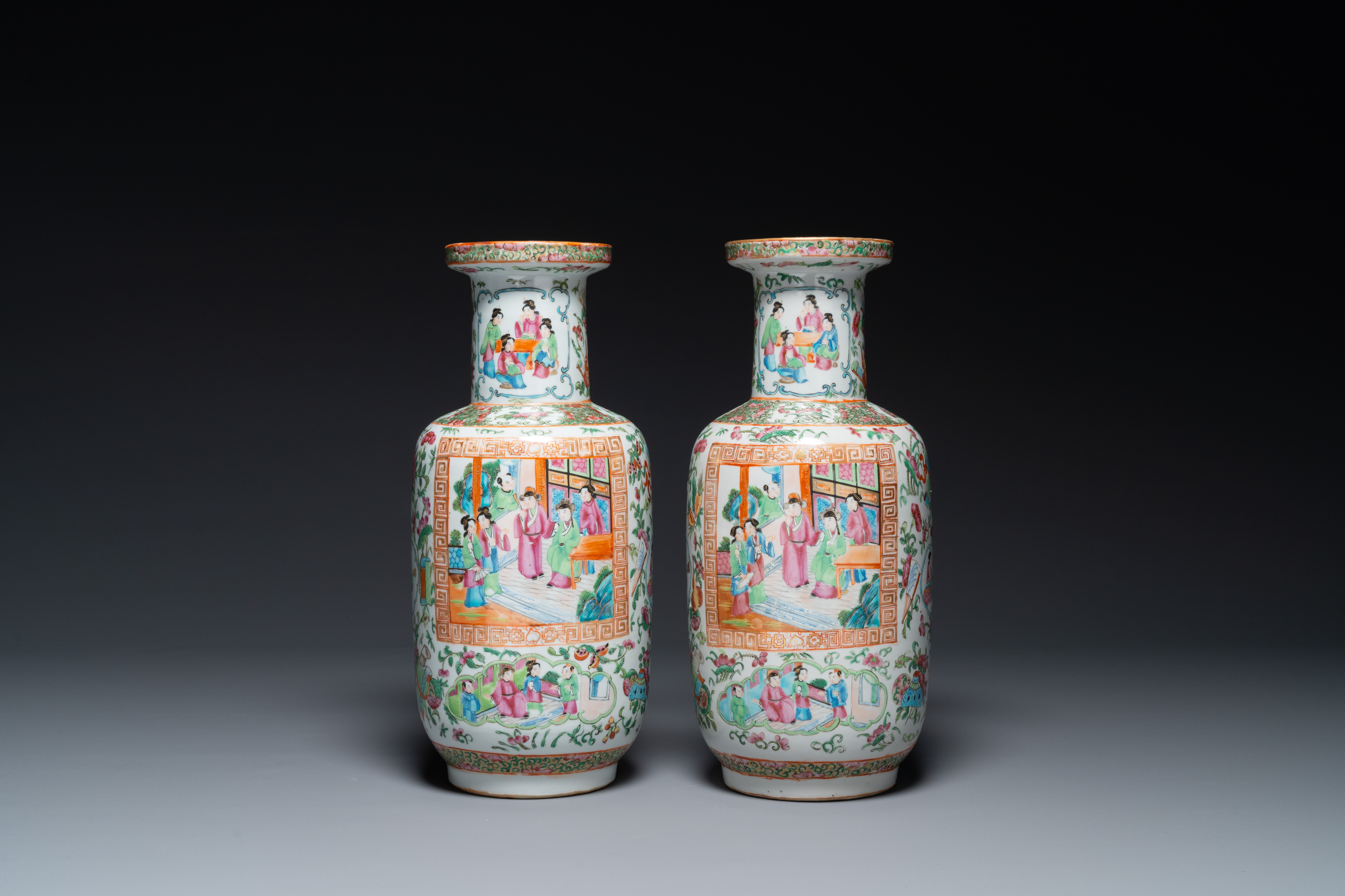 A pair of Chinese Canton famille rose vases with wooden stands, 19th C. - Image 2 of 5
