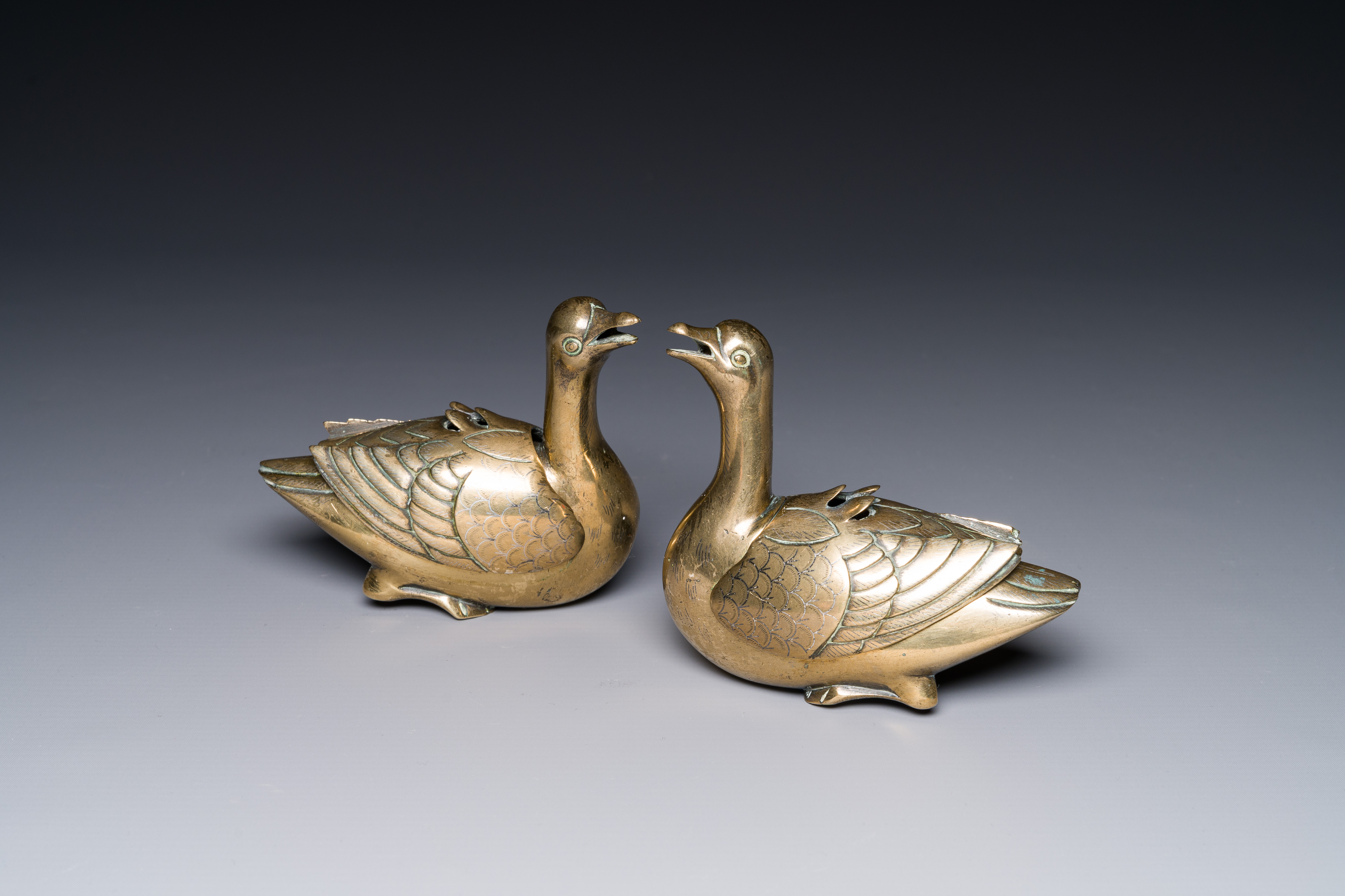 A pair of Chinese silver-inlaid bronze duck-form water droppers, Qing