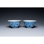 A pair of Chinese blue and white 'wan shou wu jiang' bowls, Qianlong mark and of the period