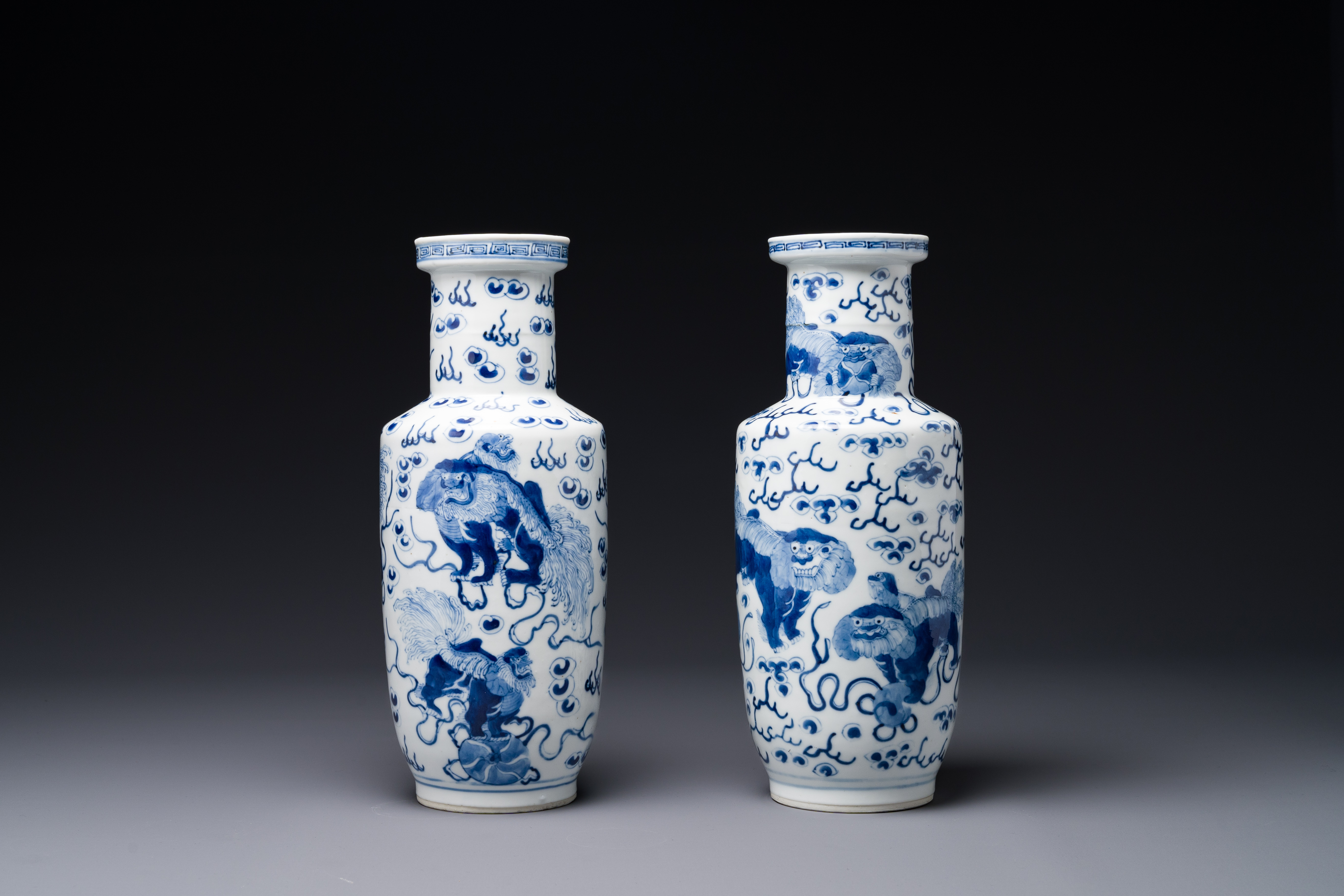 A pair of Chinese blue and white 'Buddhist lion' vases, Kangxi mark, 19th C.