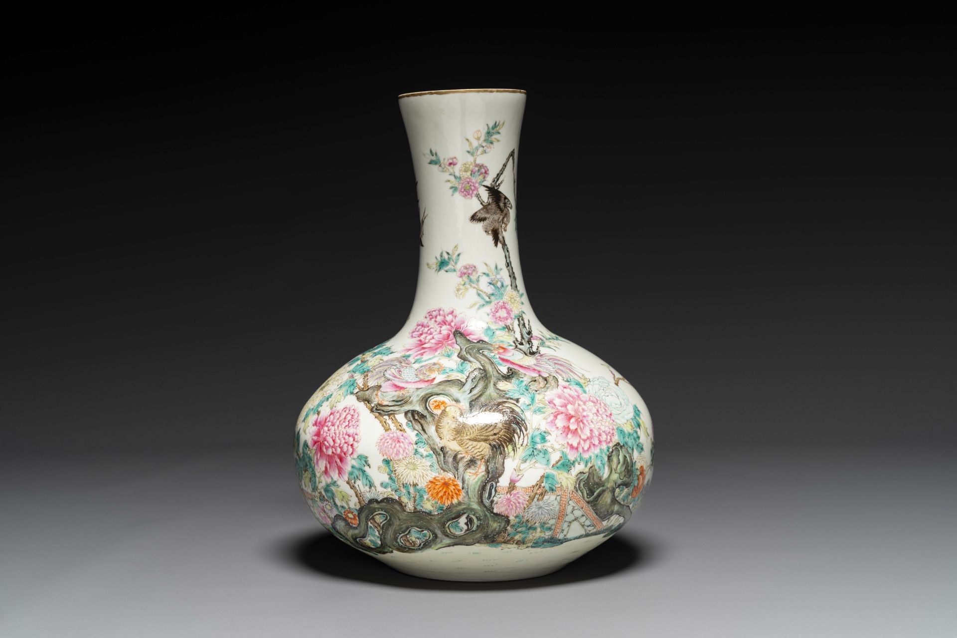 A Chinese famille rose bottle vase with birds among blossom branches, Qianlong mark, Republic