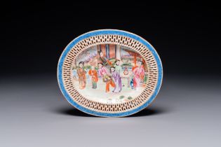 An oval Chinese Canton famille rose dish with a reticulated border, 19th C.