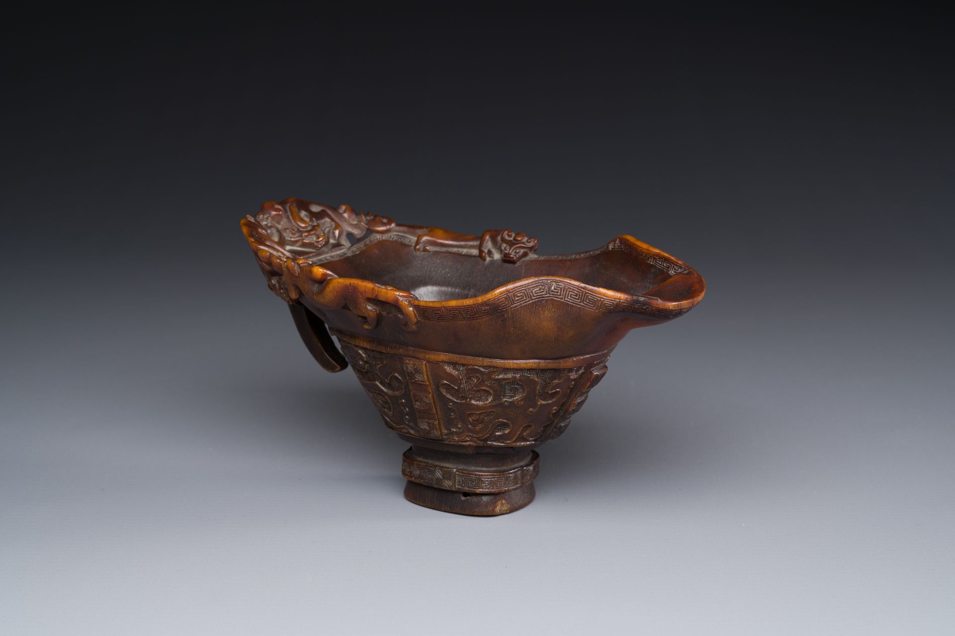 A Chinese carved rhinoceros horn 'libation cup' with chilong design, 17/18th C. - Image 2 of 8