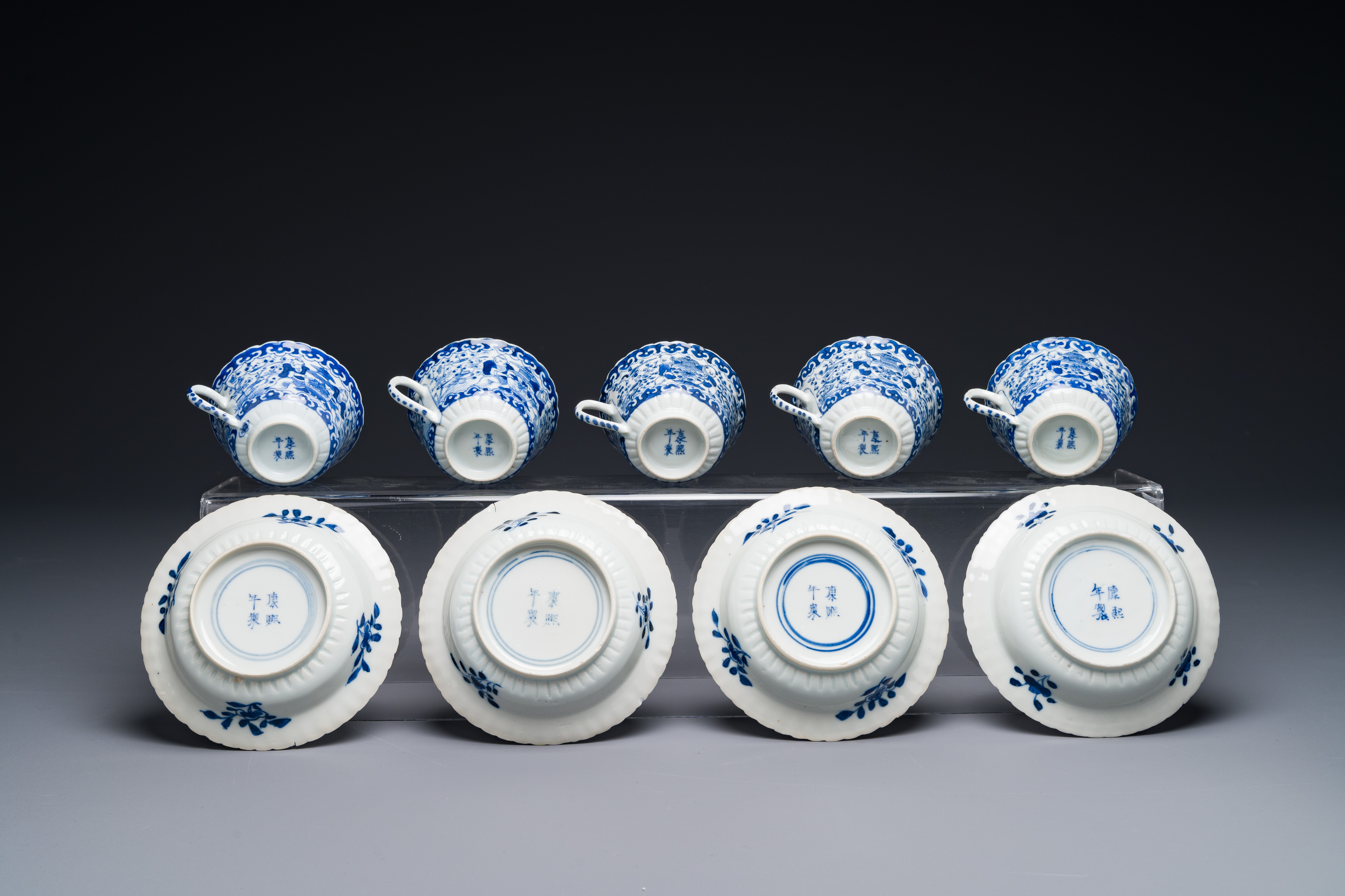 Five Chinese blue and white cups and four saucers with boys carrying a vase, Kangxi mark, Guangxu - Image 2 of 3