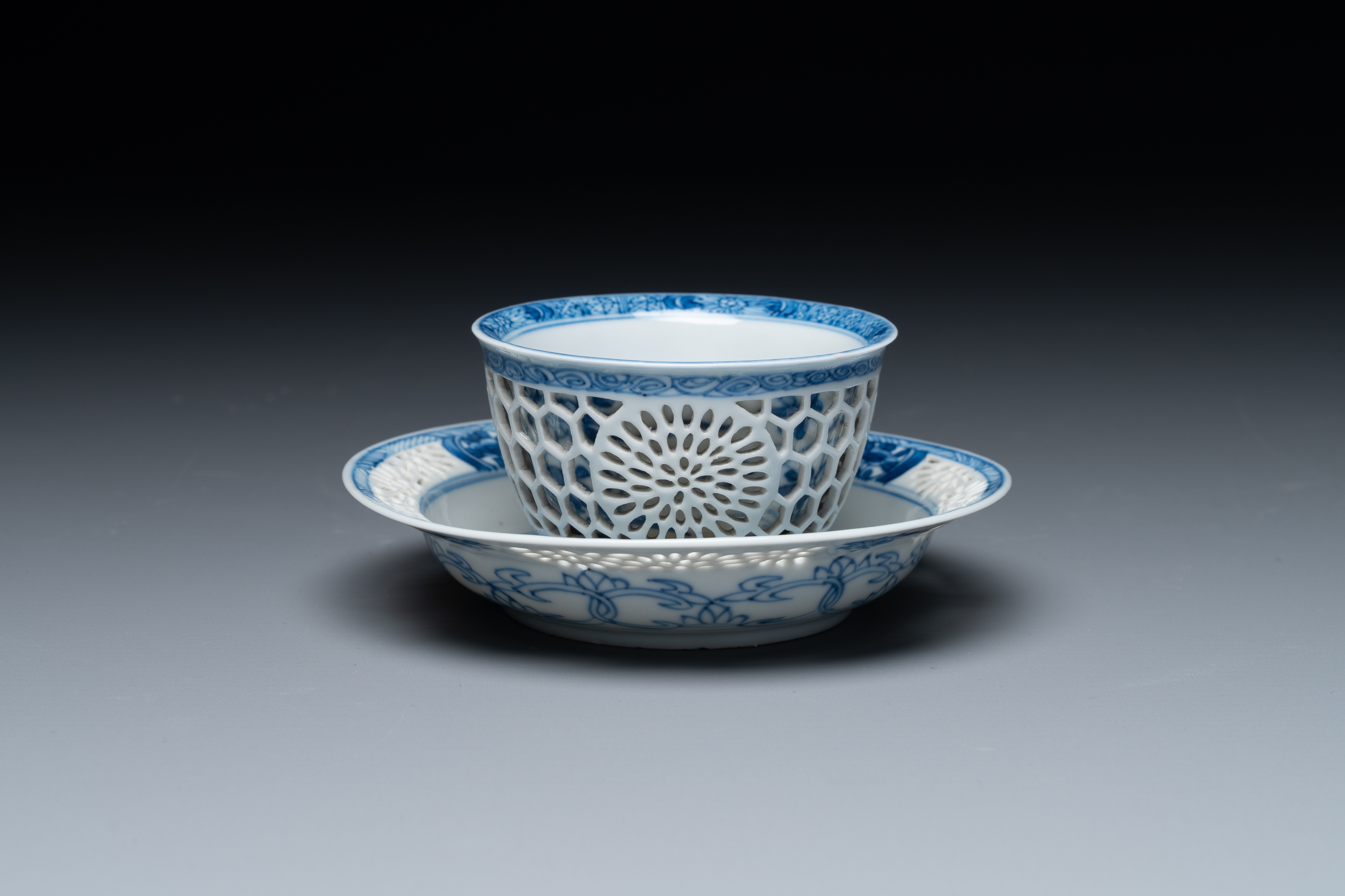 A Chinese blue and white reticulated double-walled cup and saucer, Kangxi - Image 2 of 4