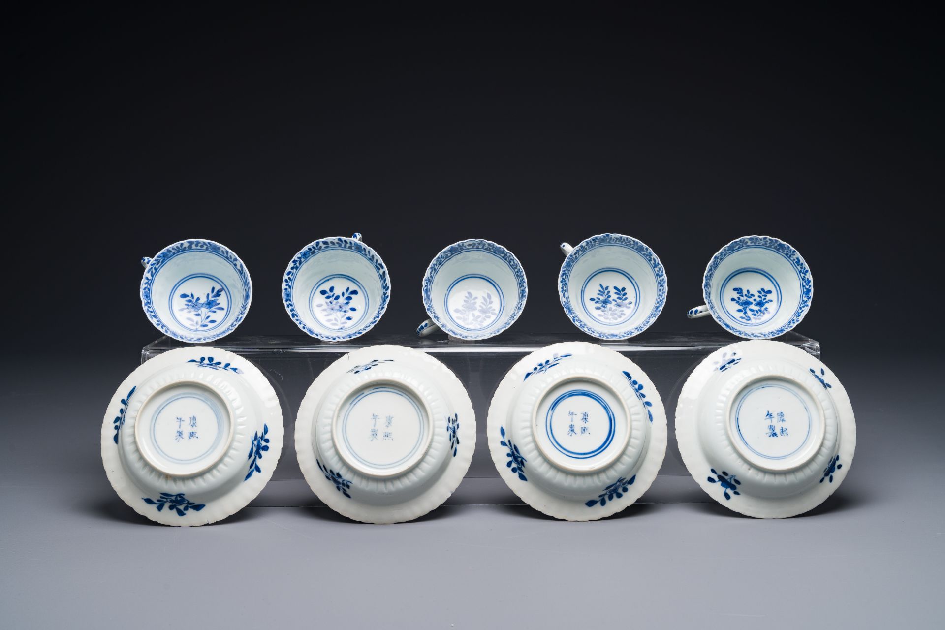 Five Chinese blue and white cups and four saucers with boys carrying a vase, Kangxi mark, Guangxu - Image 3 of 3