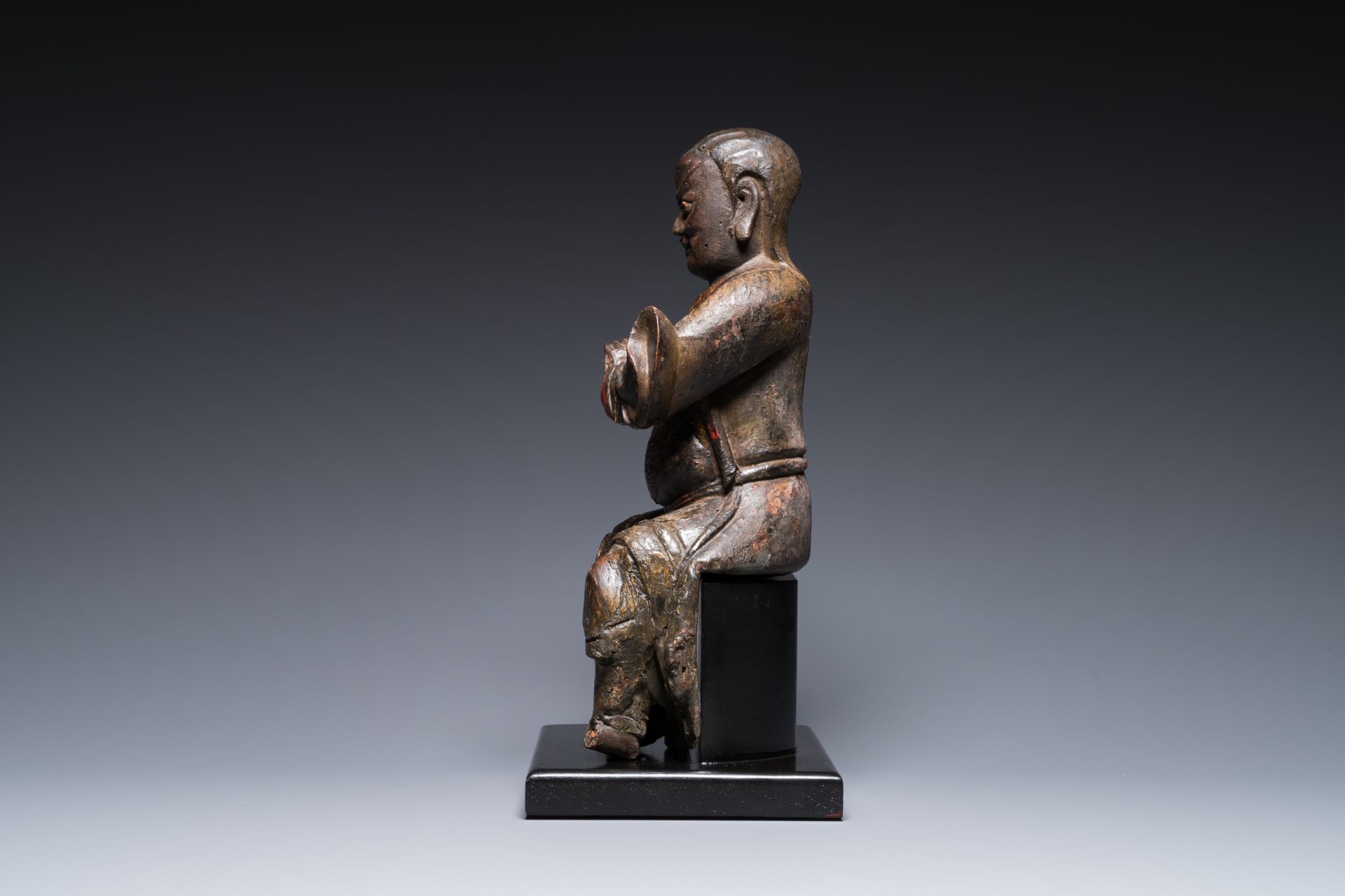 A Chinese lacquered and polychromed wood sculpture of a Buddhist guardian, Ming - Image 5 of 8