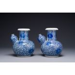 A pair of Chinese blue and white 'lotus scroll' kendis, 19th C.