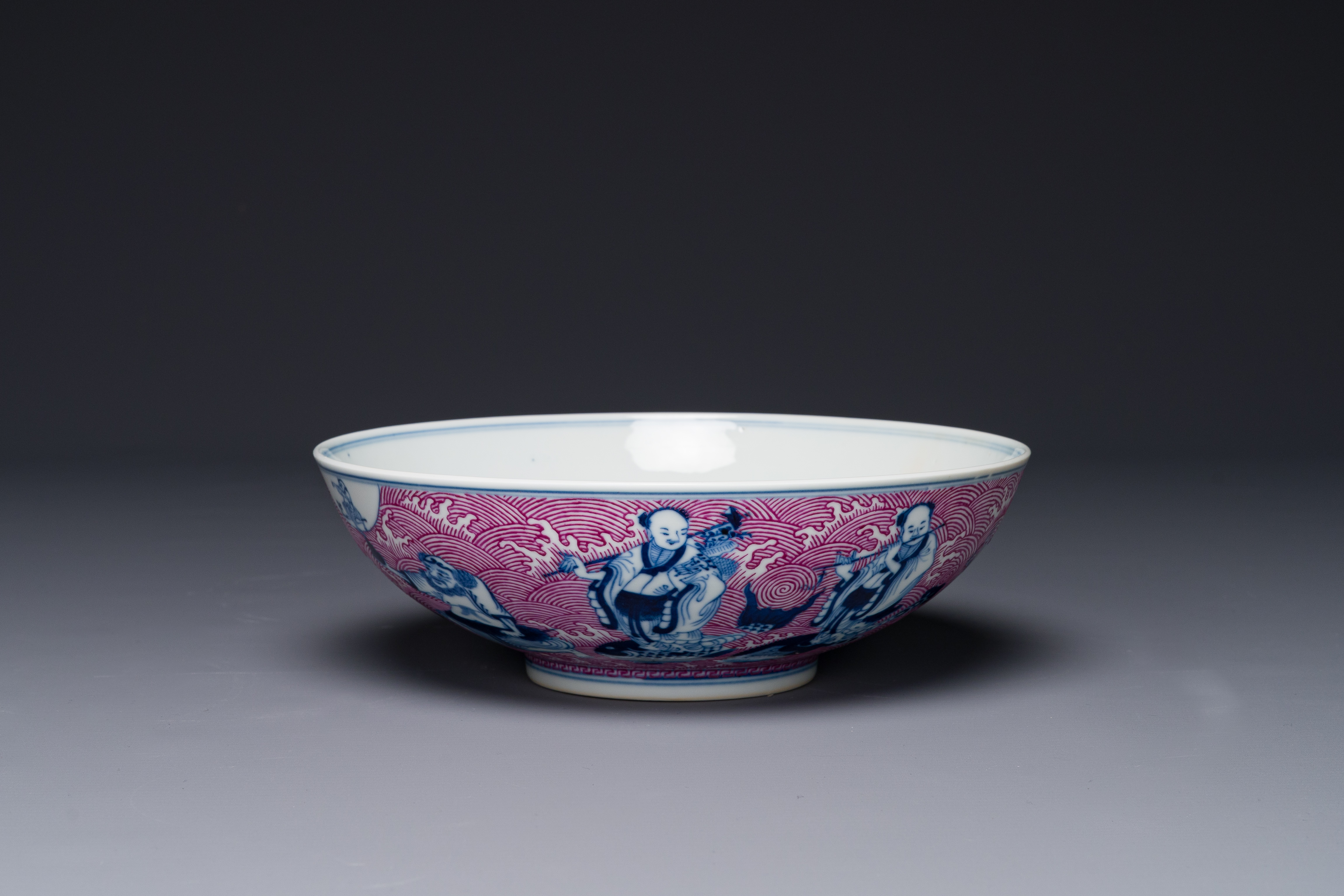 A Chinese blue, white and puce-enamelled 'Eight Immortals' bowl, Guangxu mark and of the period - Image 7 of 8