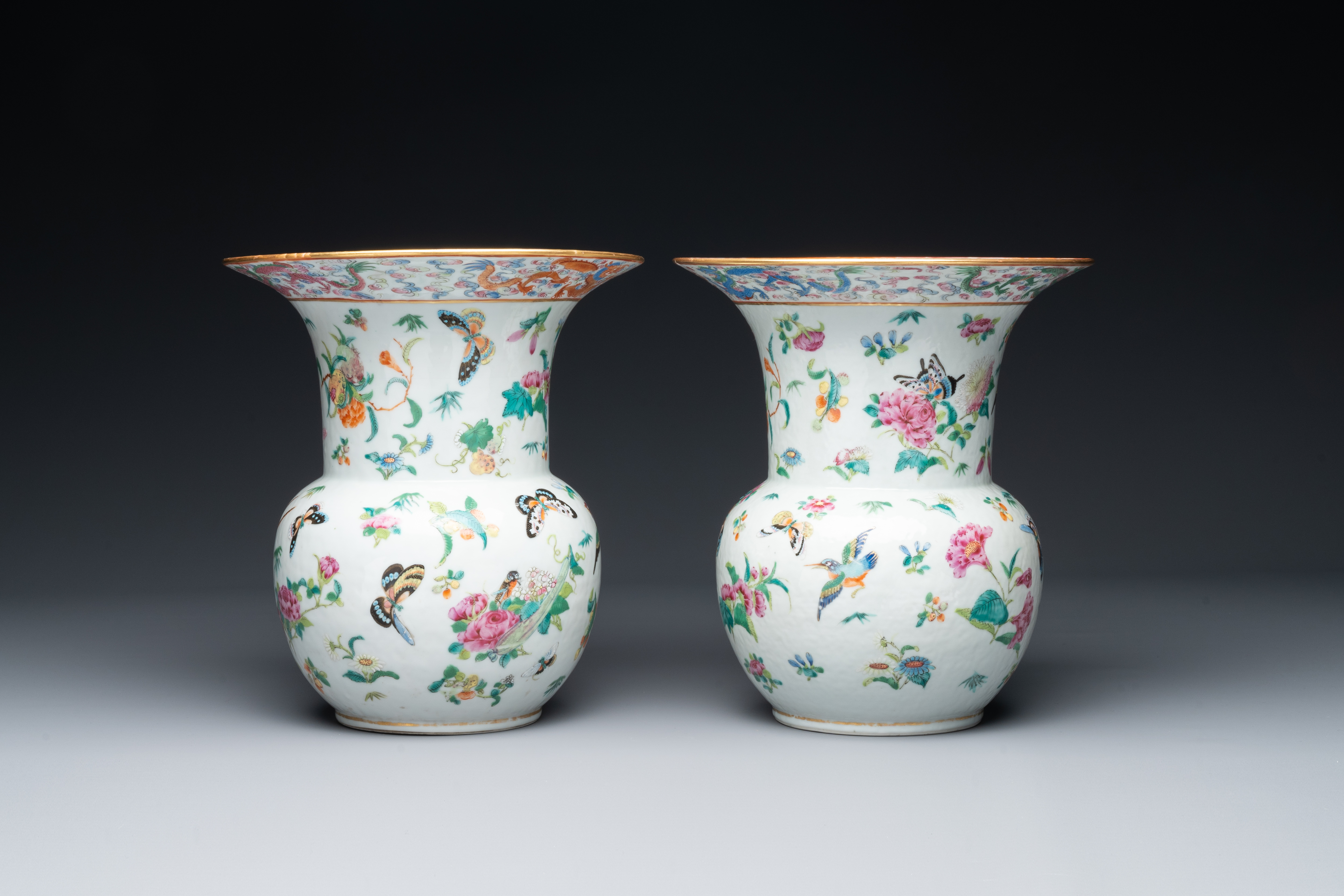 A pair of Chinese Canton famille rose spittoons with dragons, birds, butterflies and flowers, 19th C - Image 4 of 6