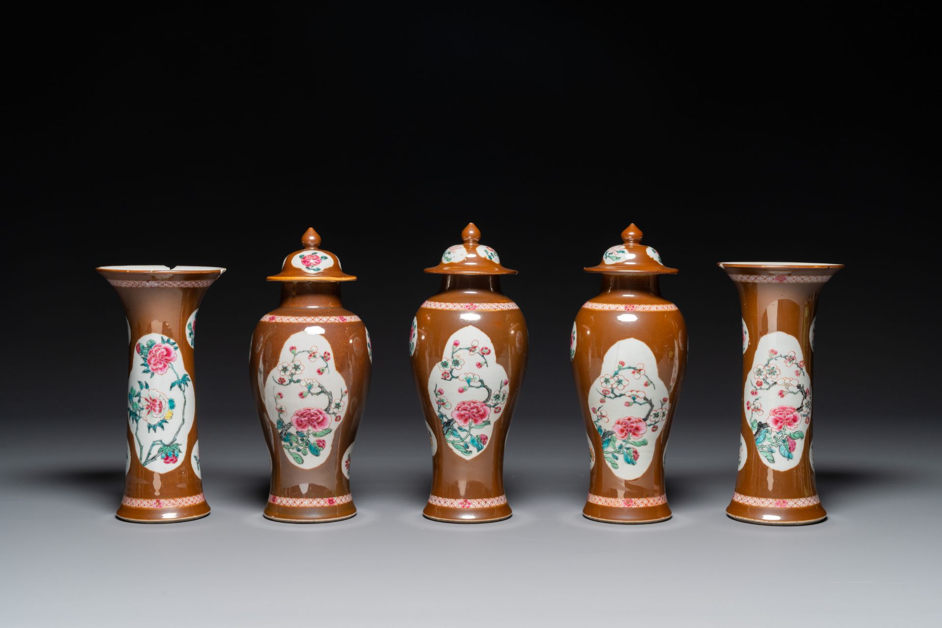 A Chinese capucin-brown-ground famille rose garniture of five vases with floral design, Yongzheng/Qi