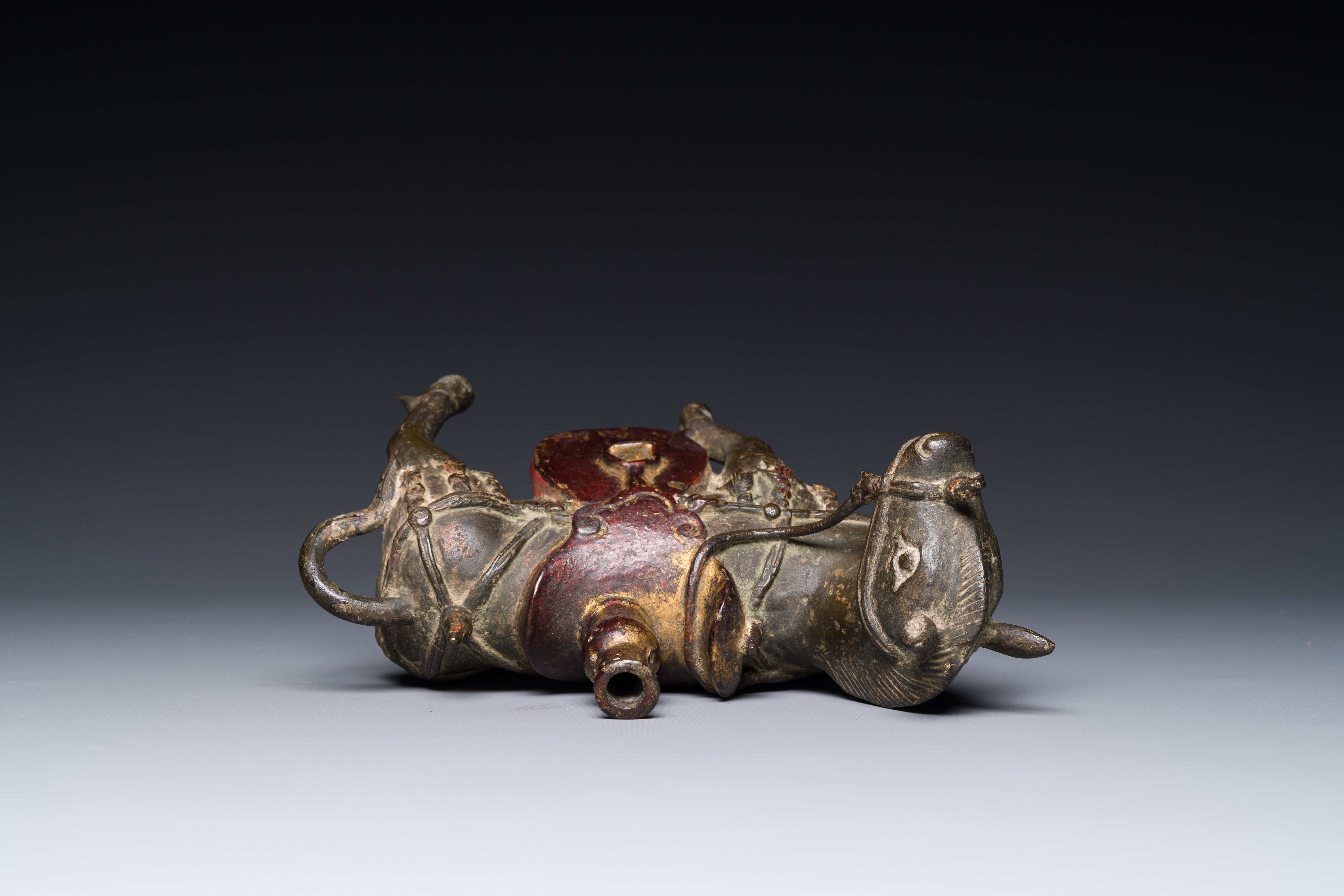 A rare Chinese partly lacquered and gilt bronze incense holder in the shape of a horse, Yuan/early M - Image 6 of 7
