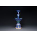 A large Chinese Canton enamel blue-ground 'shou' candlestick, Qianlong/Jiaqing