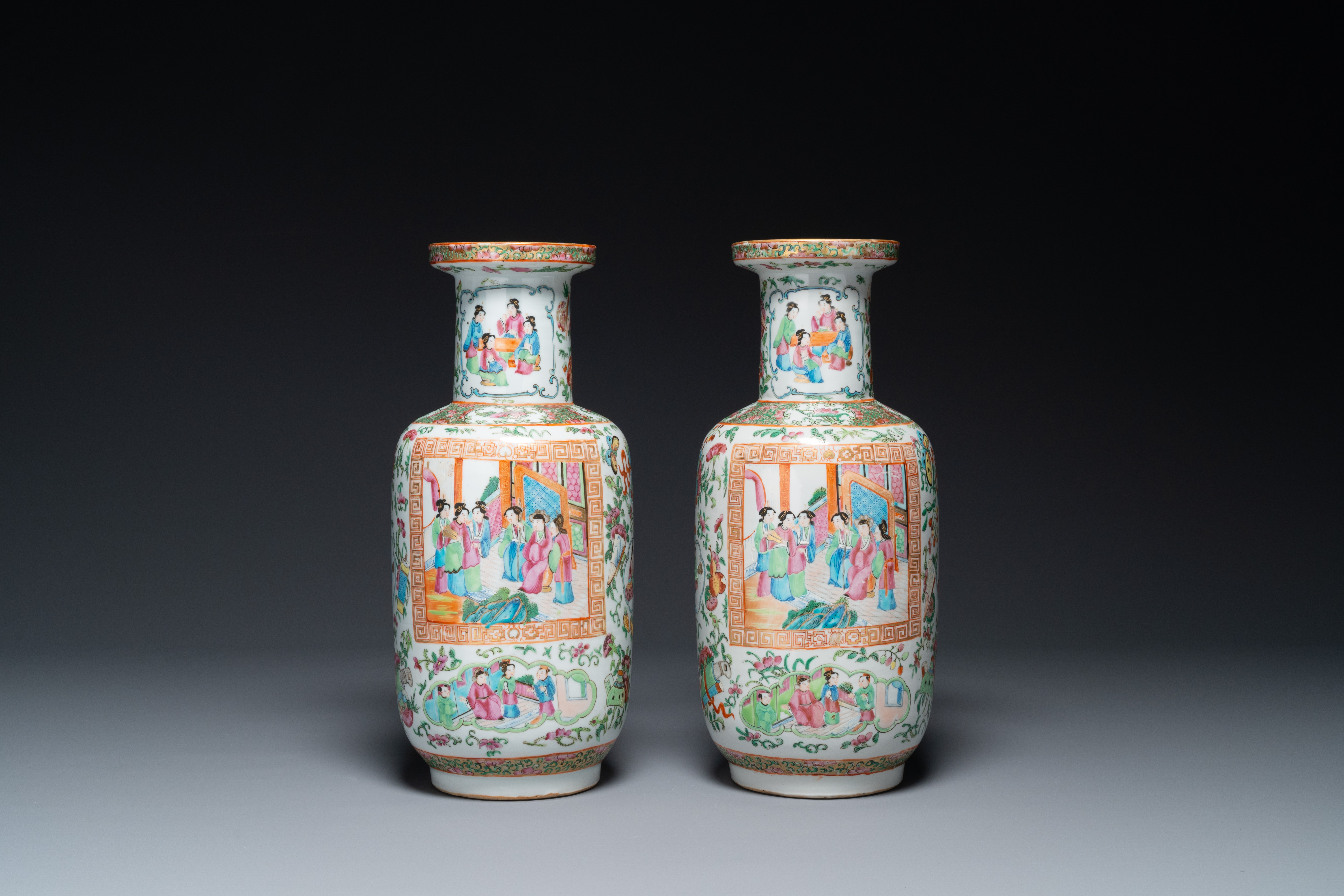 A pair of Chinese Canton famille rose vases with wooden stands, 19th C. - Image 3 of 5