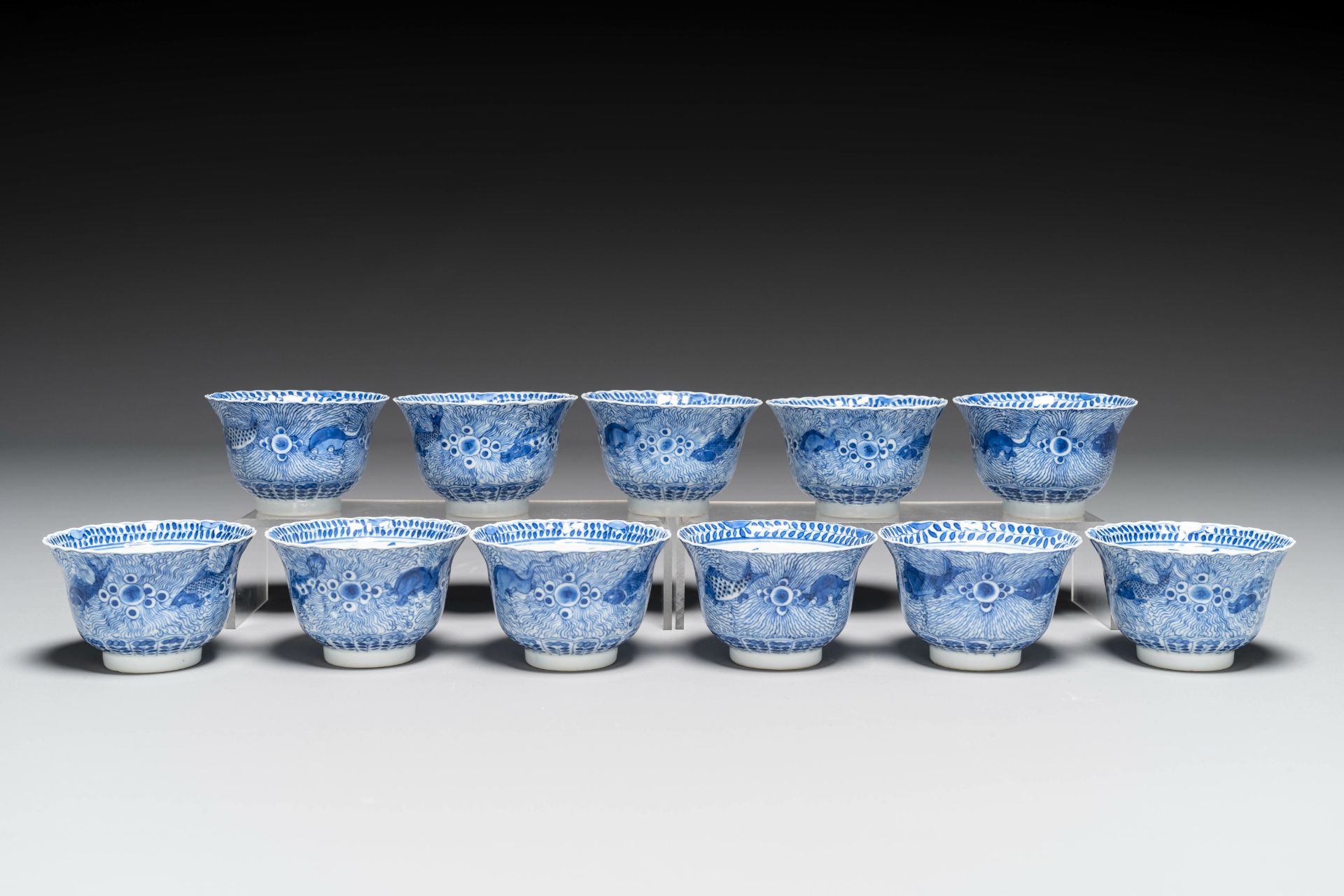 Eleven Chinese blue and white 'crab and fish' cups and saucers, Kangxi mark, Guangxu - Image 3 of 7