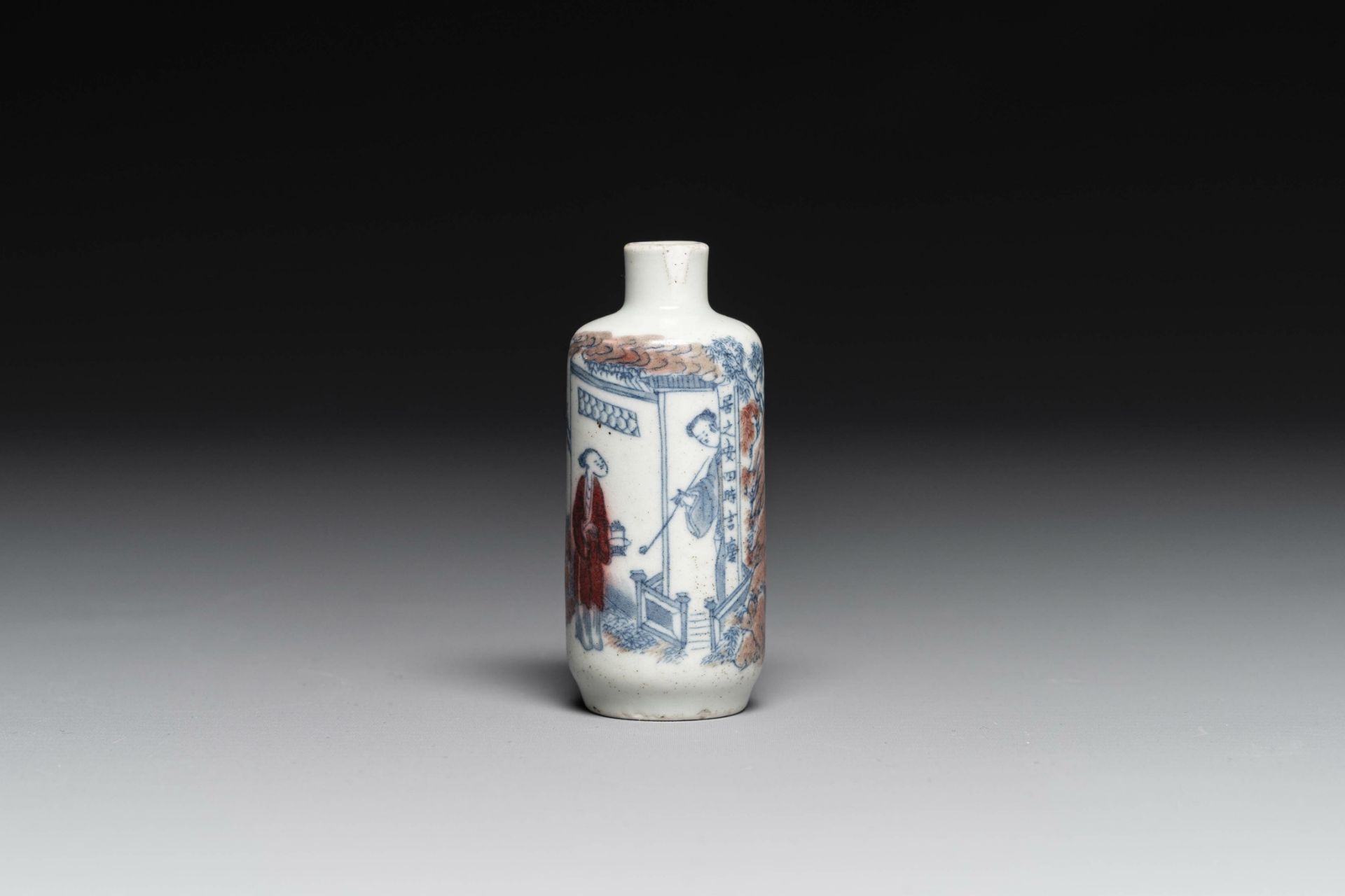 A Chinese blue, white and copper-red snuff bottle with inscription, 19th C.