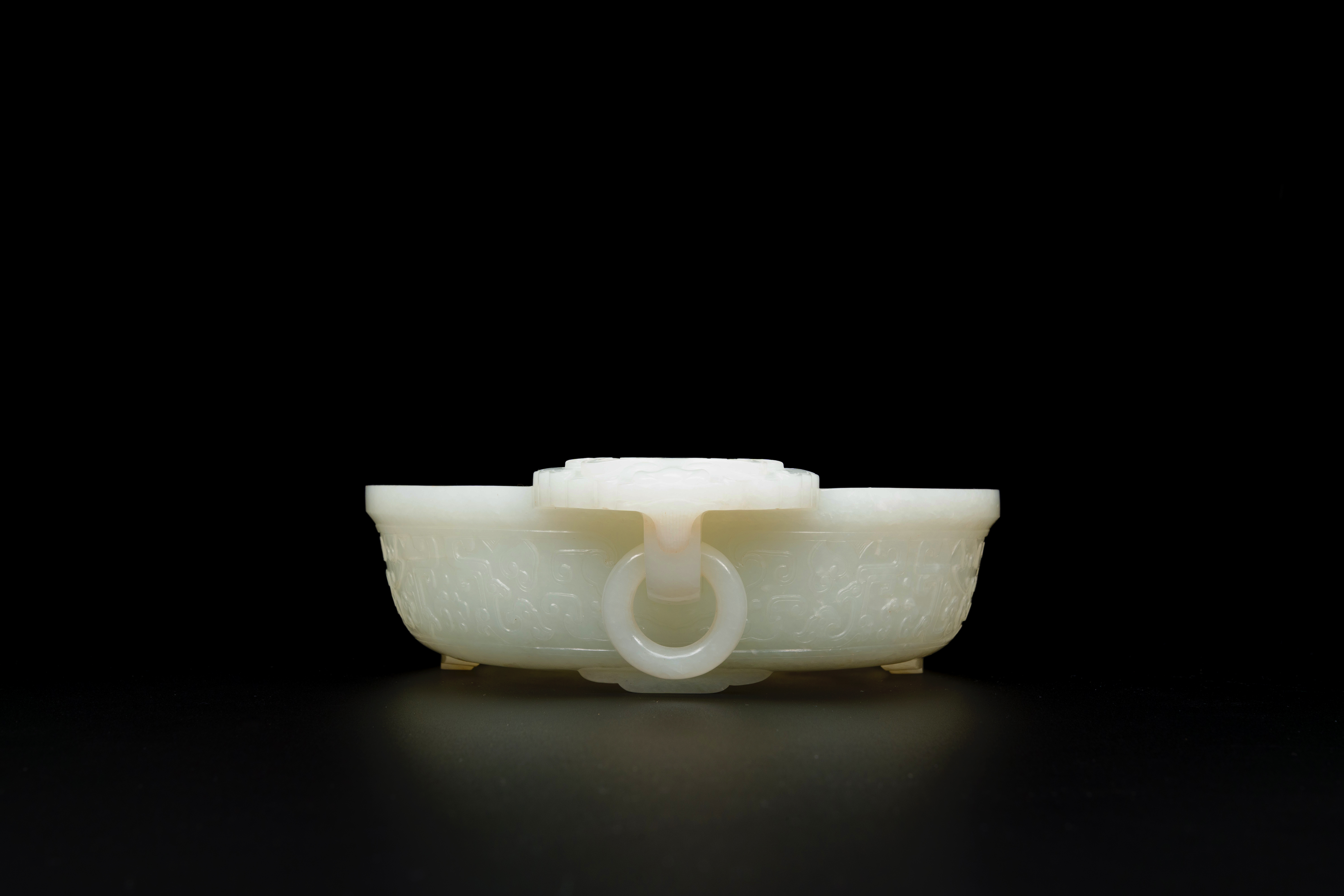 An important Chinese chrysanthemum-shaped very pale celadon jade marriage bowl, 18th C. - Image 2 of 8