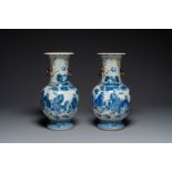 A pair of Chinese blue and white Nanking crackle-glazed 'Taoist' vases, 19th C.
