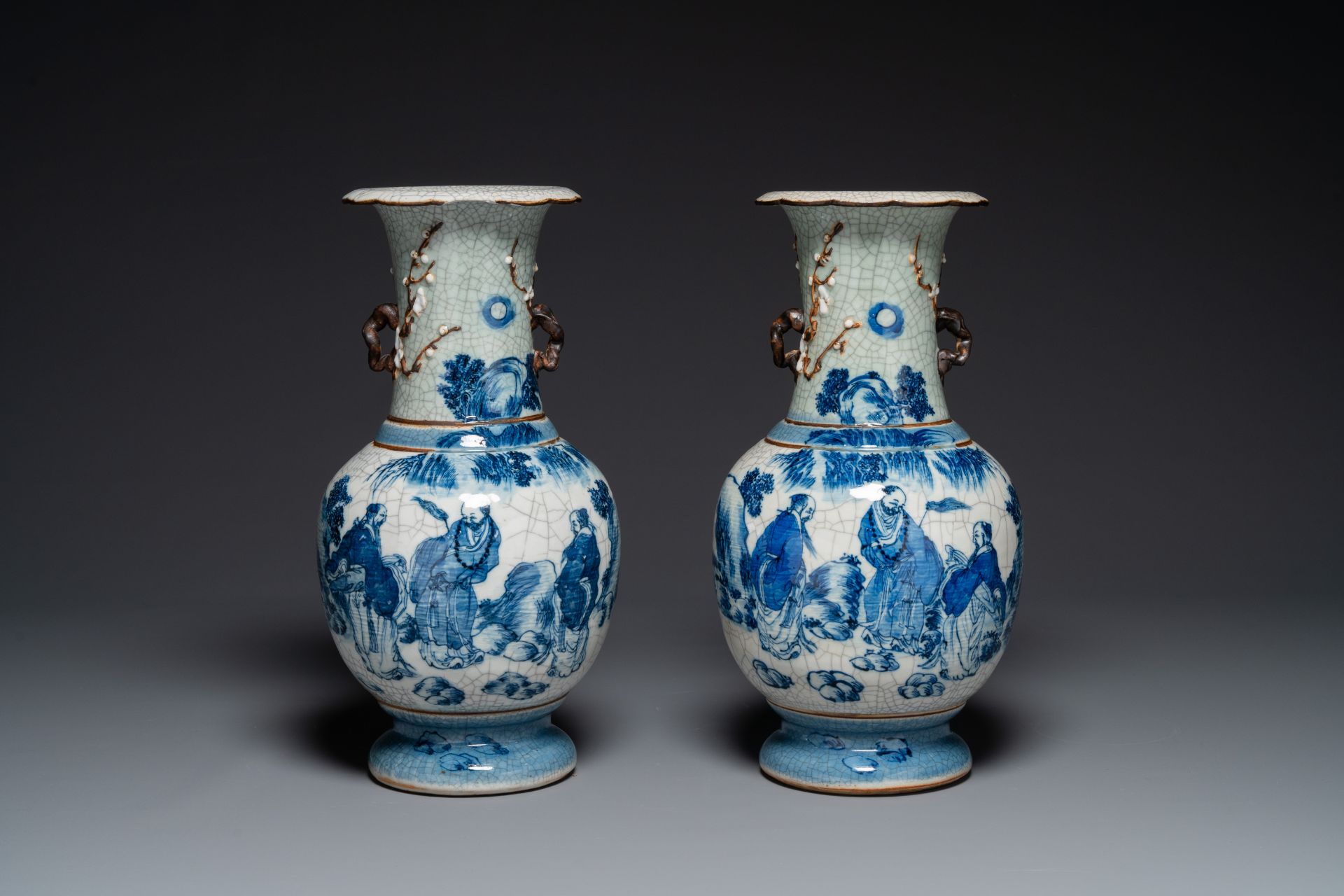 A pair of Chinese blue and white Nanking crackle-glazed 'Taoist' vases, 19th C.