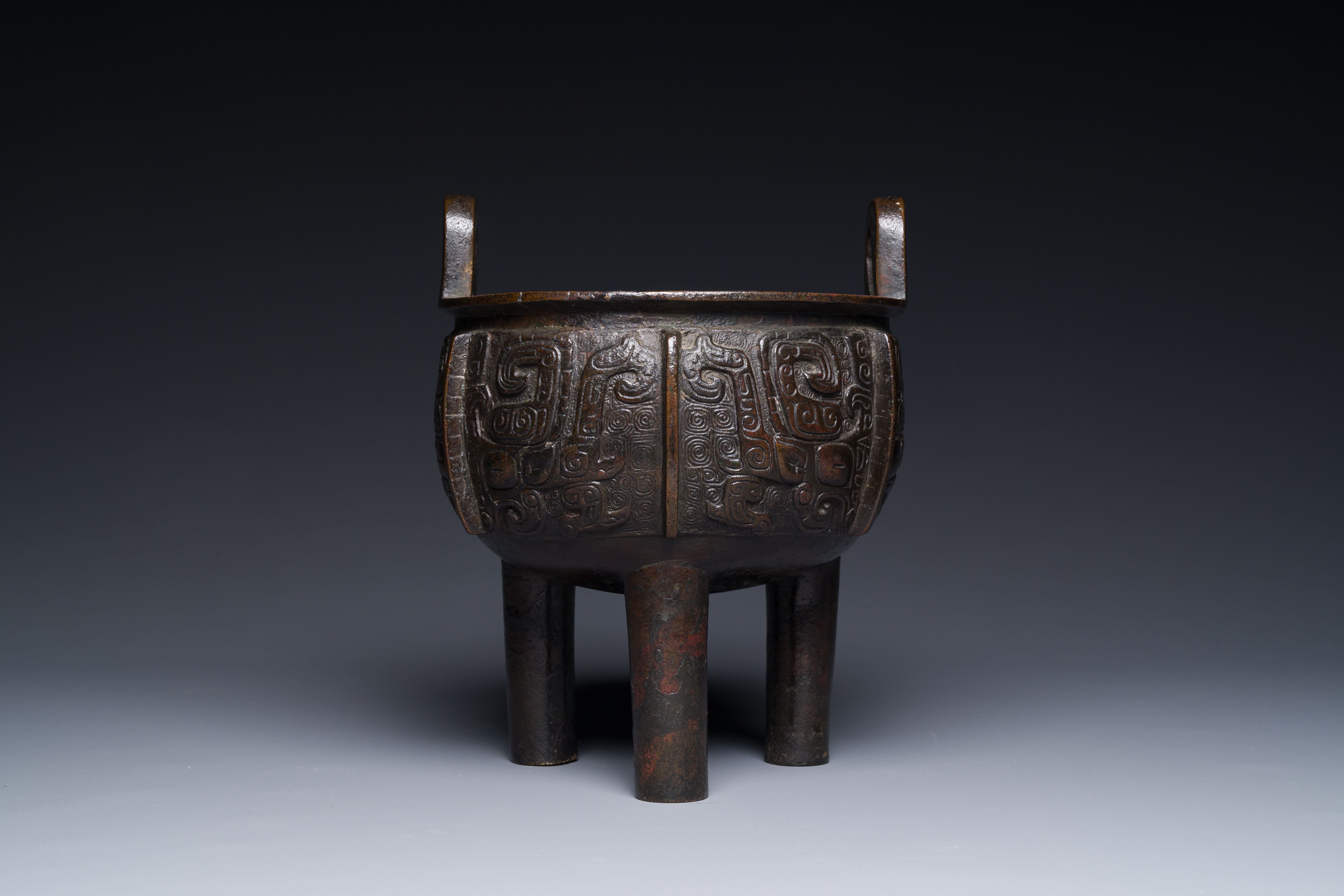 A Chinese archaistic bronze tripod censer on wooden stand, 'ding', Song/Ming - Image 5 of 21