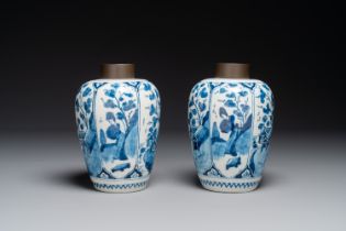 A pair of Dutch Delft blue and white chinoiserie vases with wooden coverd, 18th C.