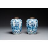 A pair of Dutch Delft blue and white chinoiserie vases with wooden coverd, 18th C.