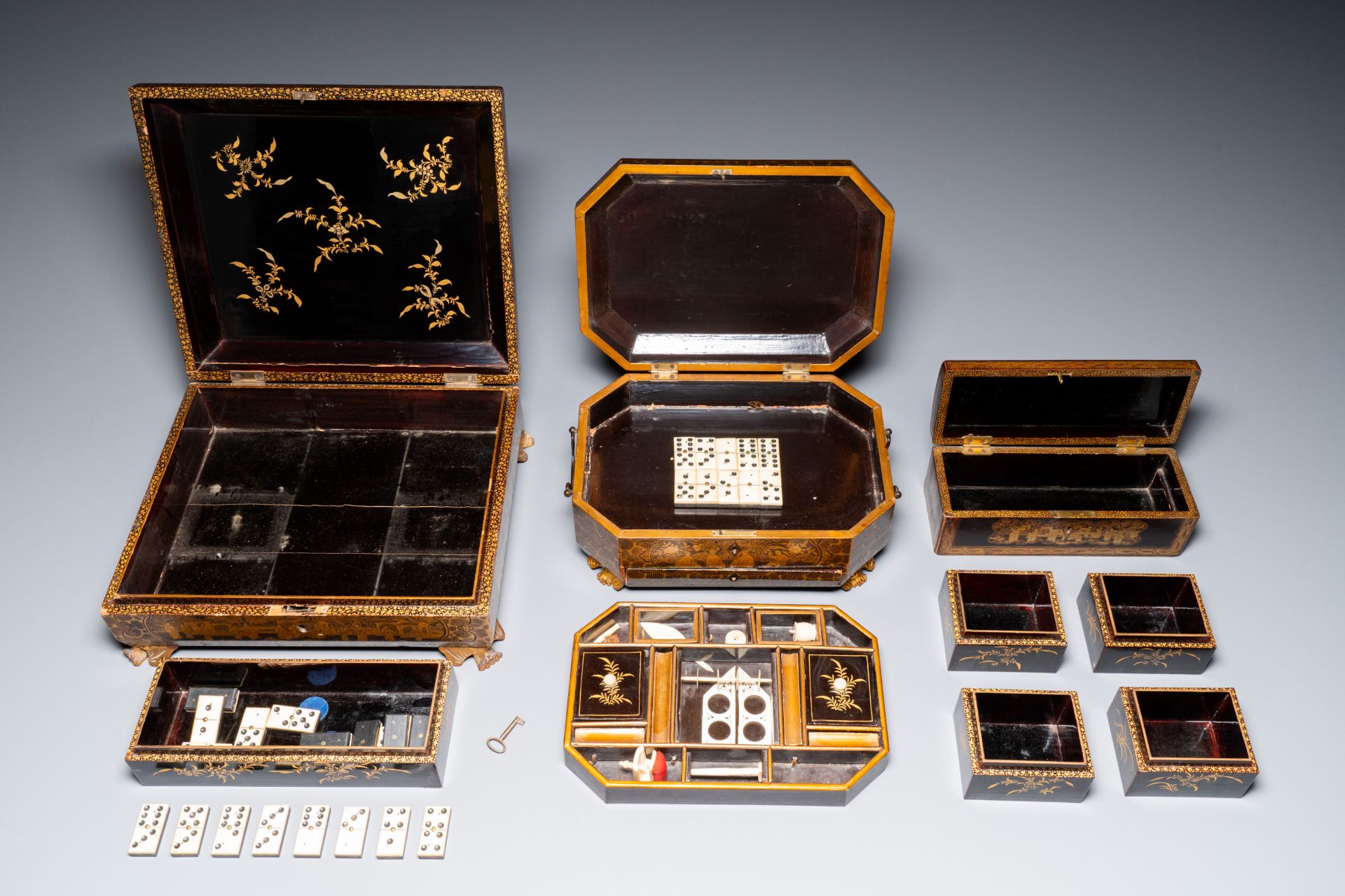 A large Chinese Canton gilt black lacquer tray, thee boxes and a fan, 19th C. - Image 17 of 17