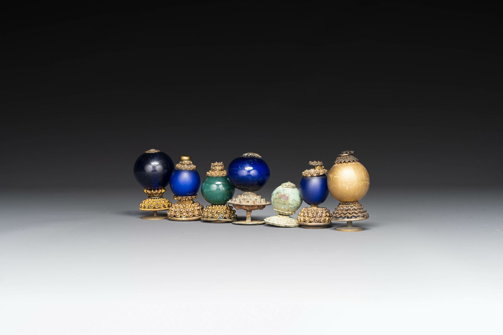 Seven Chinese gilt bronze Mandarin hat finials, Qing