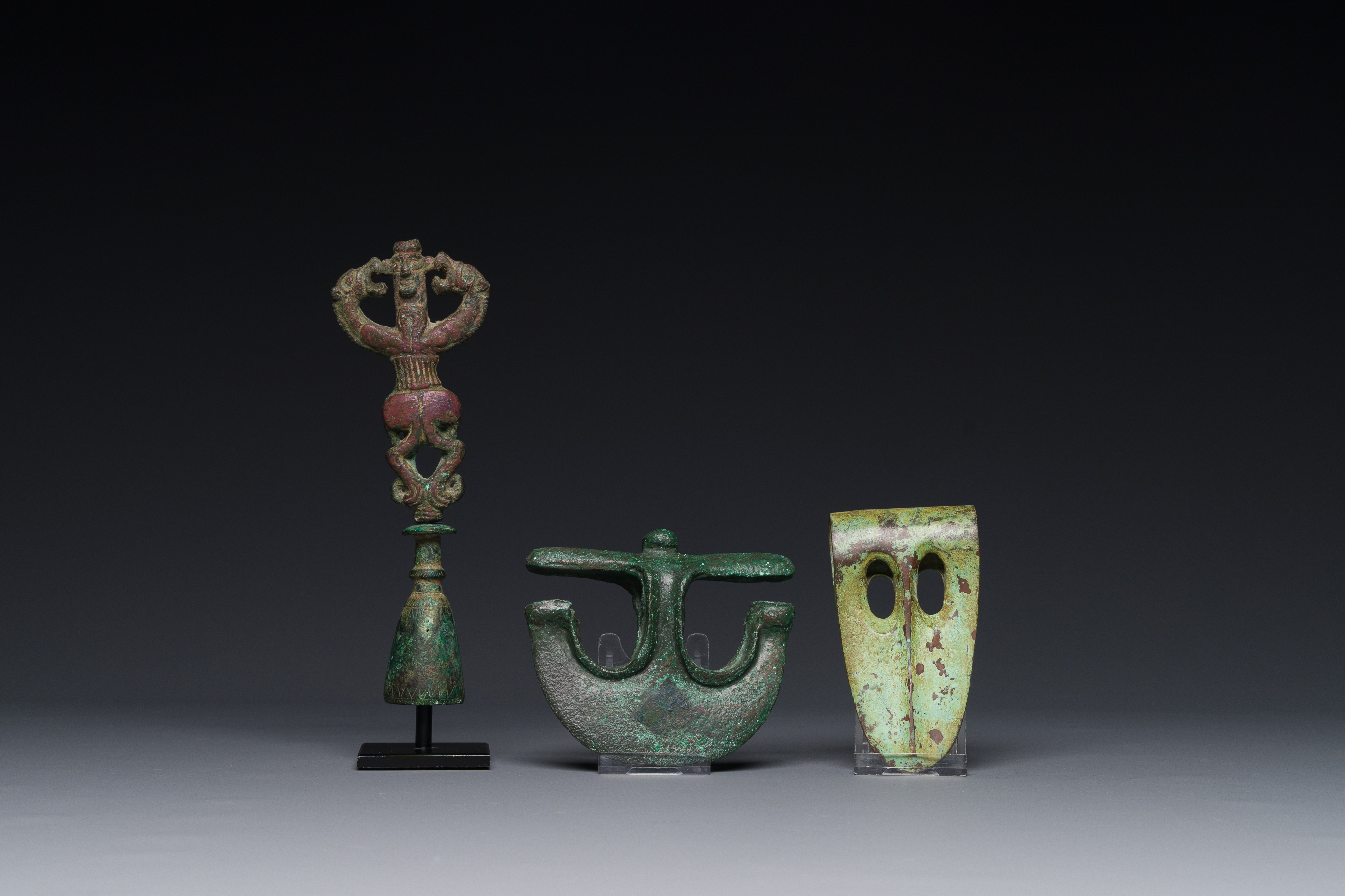 A collection of three bronze axes, a mirror and an anthropomorphic idol with two dragon heads, Luris - Image 9 of 15