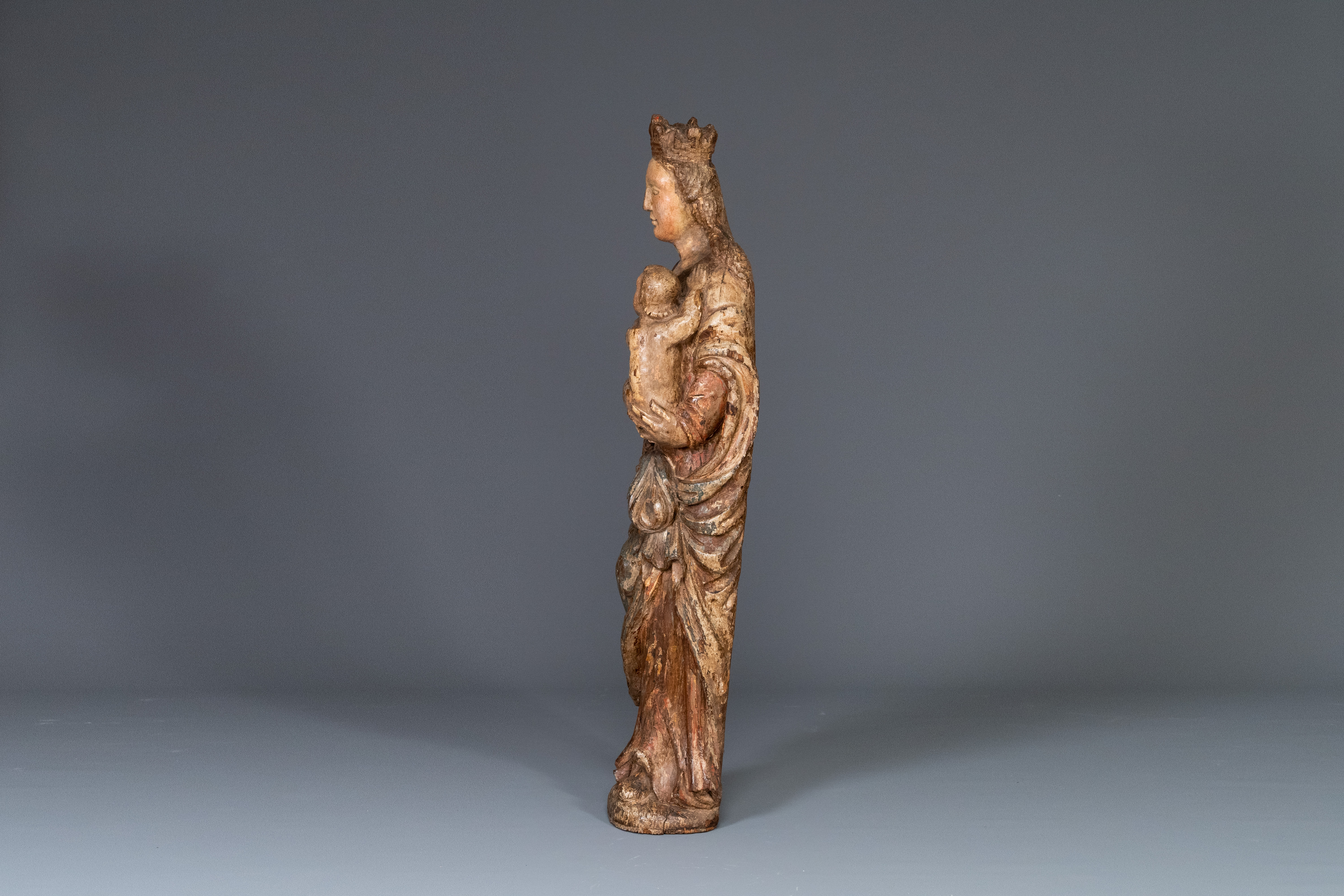 A polychromed carved oak figure of a Madonna and Child, France, 2nd half of 16th C. - Image 3 of 16