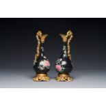 A pair of Chinese black-ground famille rose vases with gilt bronze mounts, Yongzheng