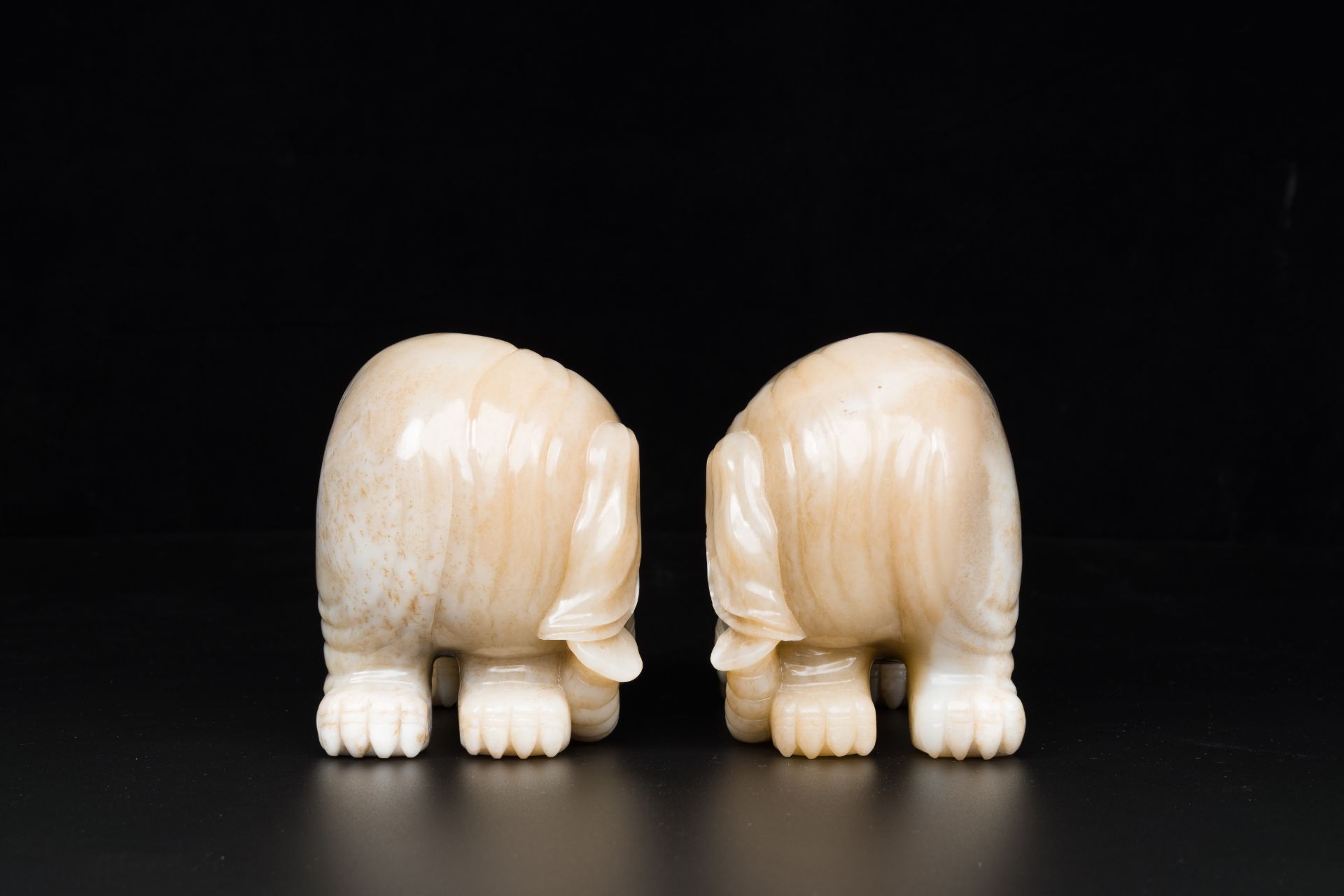 A pair of Chinese white and russet jade sculptures of elephants, Qianlong - Image 7 of 9