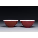 A pair of Chinese monochrome ruby-glazed bowls, Guangxu mark and of the period