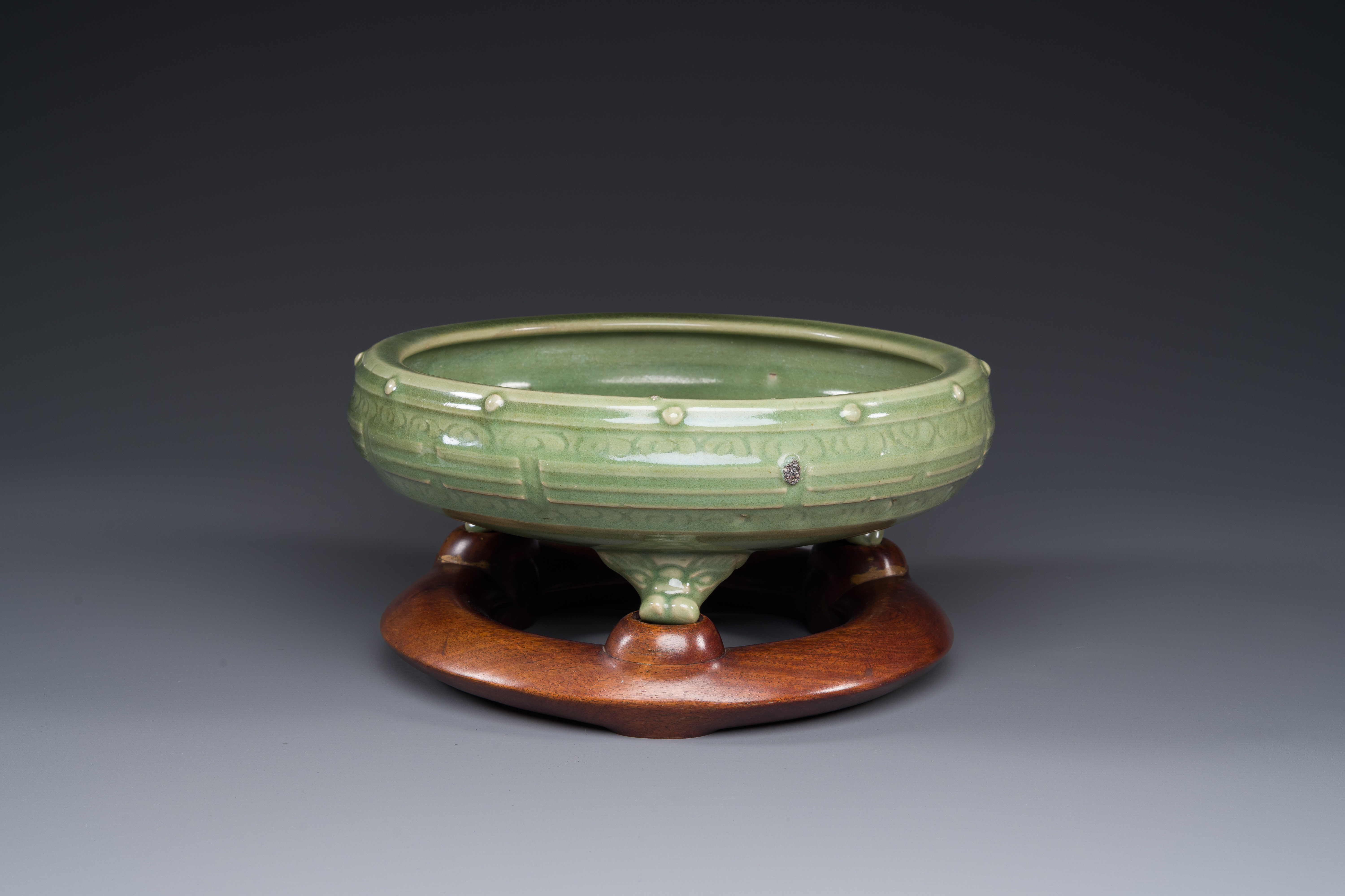 A Chinese Longquan celadon tripod censer on wooden stand, Yuan/Ming - Image 8 of 10