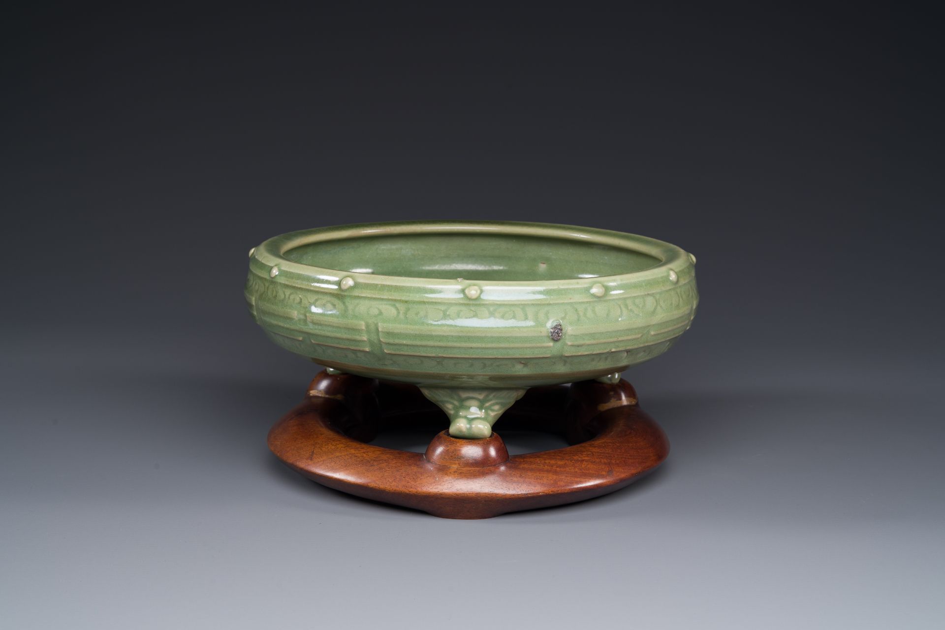 A Chinese Longquan celadon tripod censer on wooden stand, Yuan/Ming - Image 8 of 10