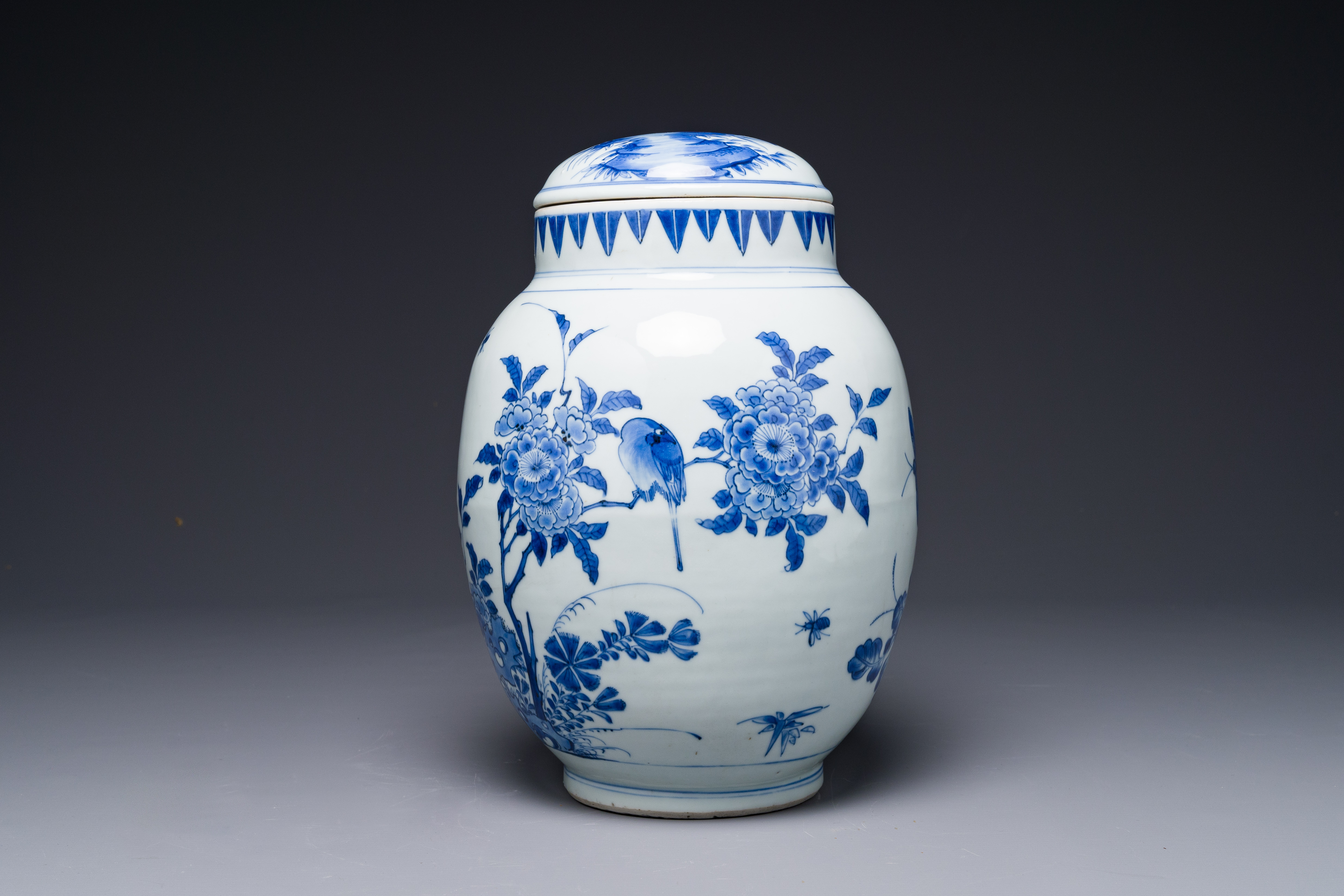 A Chinese blue and white jar and cover with birds and flowers, Transitional period