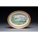 An oval Chinese monogrammed Canton famille rose dish with landscape design, 19th C.