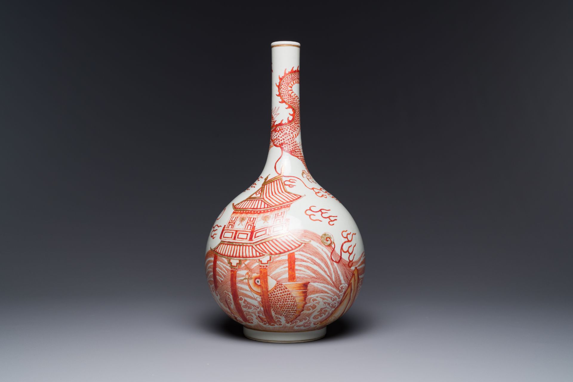 A Chinese iron-red-decorated and gilded 'dragon and carp' bottle vase, 19/20th C. - Image 2 of 3