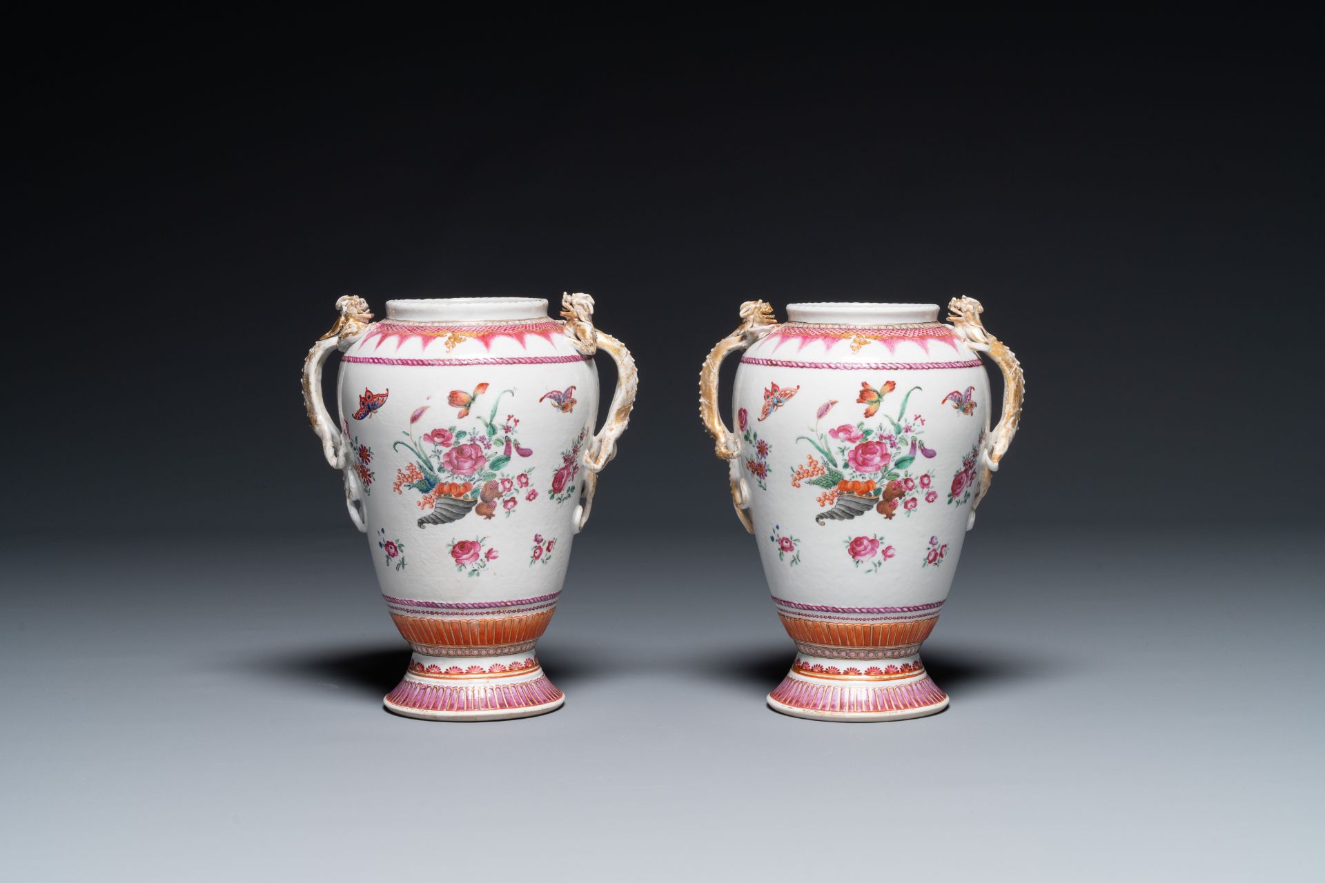 A pair of Chinese famille rose 'cornucopia' vases with chilong handles, Qianlong